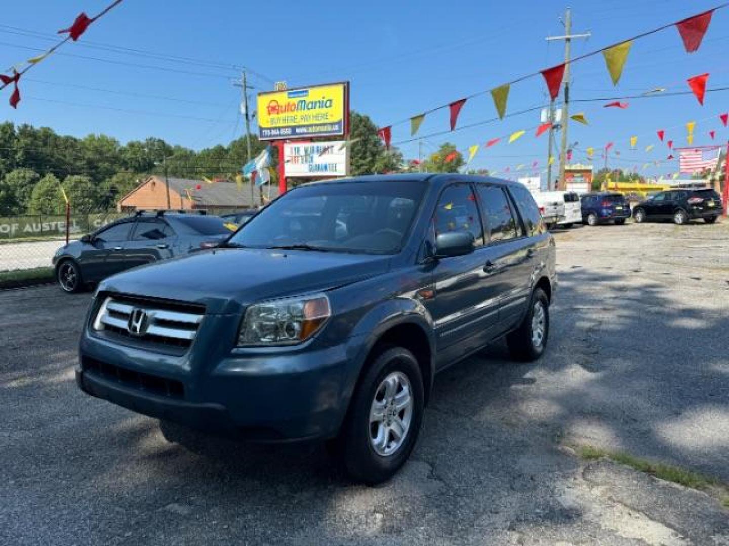 2006 Blue Honda Pilot LX (5FNYF28106B) with an 3.5L V6 SOHC 24V engine, 5-Speed Automatic transmission, located at 1806 Veterans Memorial Hwy SW, Austell, GA, 30168, (770) 944-9558, 33.817959, -84.606987 - Photo#0