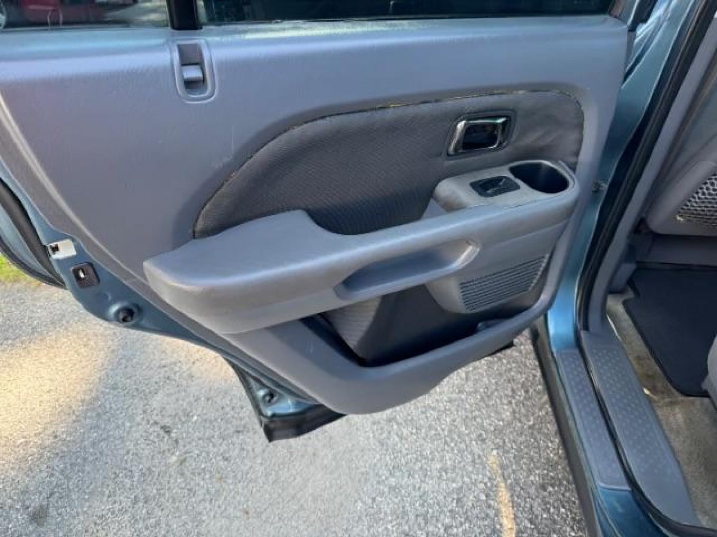 2006 Blue Honda Pilot LX (5FNYF28106B) with an 3.5L V6 SOHC 24V engine, 5-Speed Automatic transmission, located at 1806 Veterans Memorial Hwy SW, Austell, GA, 30168, (770) 944-9558, 33.817959, -84.606987 - Photo#10