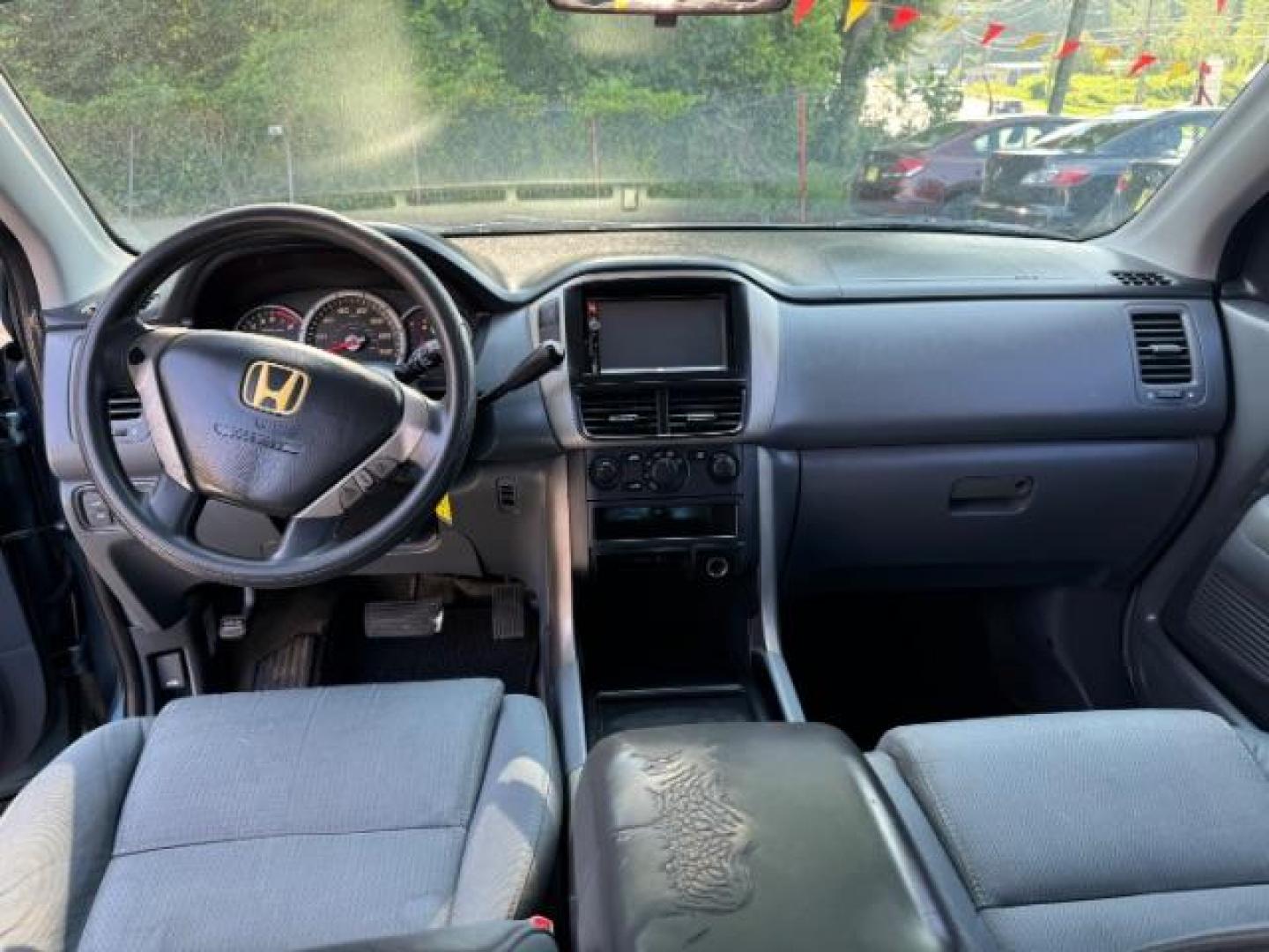 2006 Blue Honda Pilot LX (5FNYF28106B) with an 3.5L V6 SOHC 24V engine, 5-Speed Automatic transmission, located at 1806 Veterans Memorial Hwy SW, Austell, GA, 30168, (770) 944-9558, 33.817959, -84.606987 - Photo#11