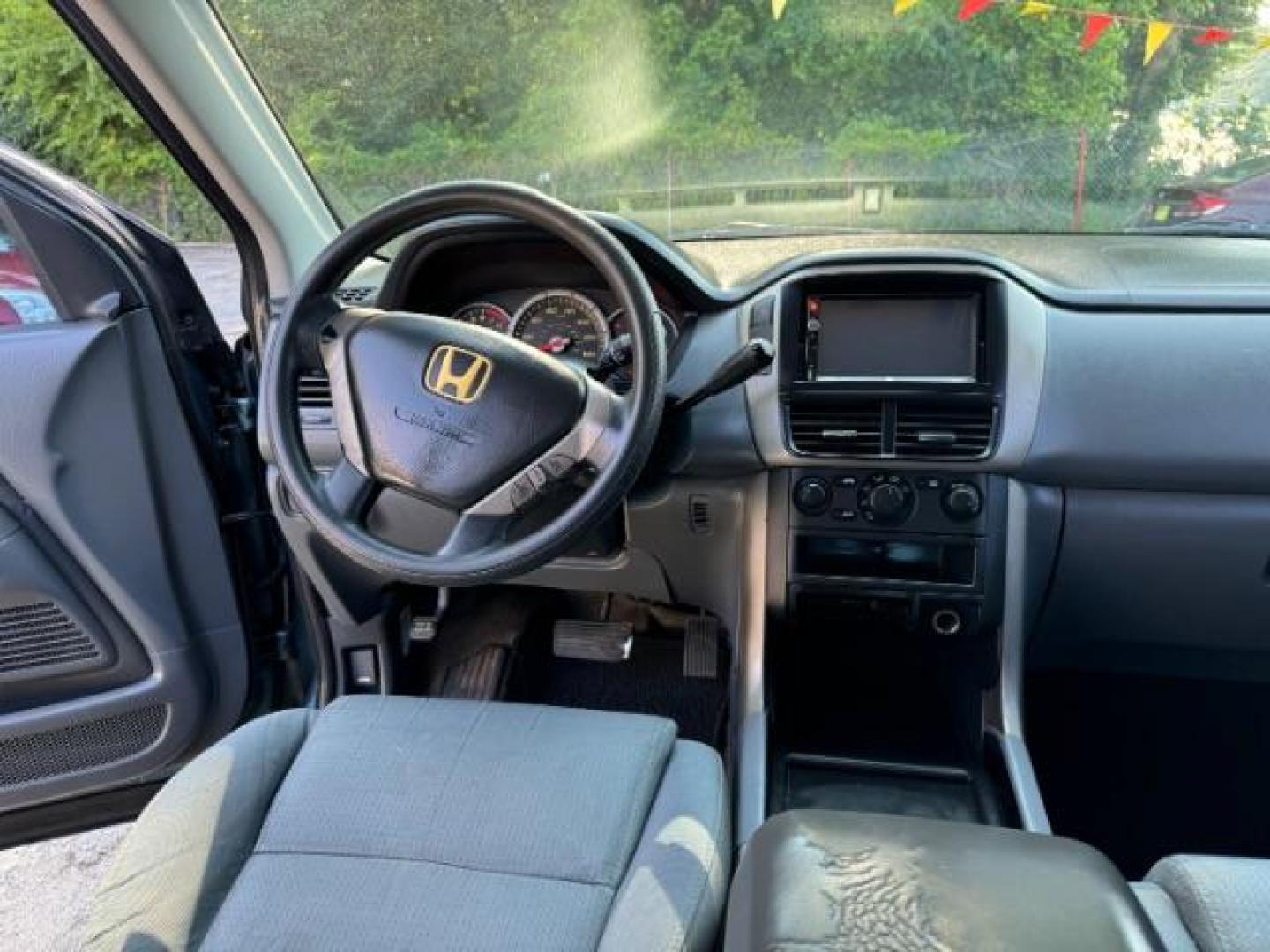 2006 Blue Honda Pilot LX (5FNYF28106B) with an 3.5L V6 SOHC 24V engine, 5-Speed Automatic transmission, located at 1806 Veterans Memorial Hwy SW, Austell, GA, 30168, (770) 944-9558, 33.817959, -84.606987 - Photo#12