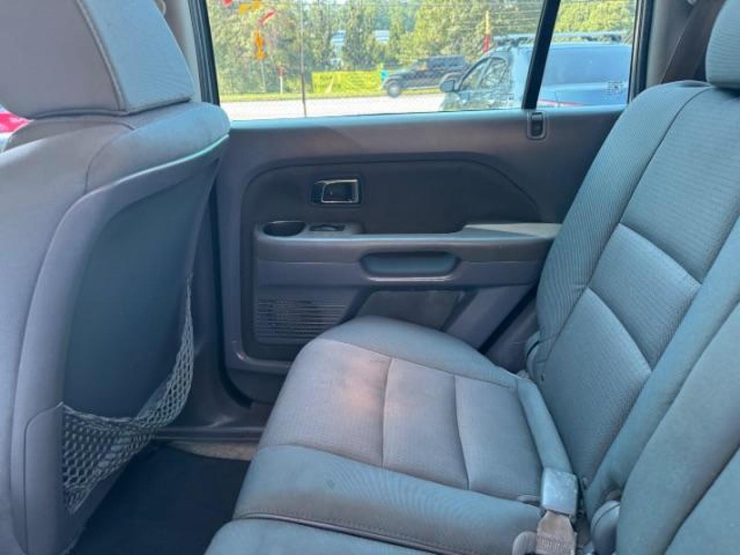 2006 Blue Honda Pilot LX (5FNYF28106B) with an 3.5L V6 SOHC 24V engine, 5-Speed Automatic transmission, located at 1806 Veterans Memorial Hwy SW, Austell, GA, 30168, (770) 944-9558, 33.817959, -84.606987 - Photo#15