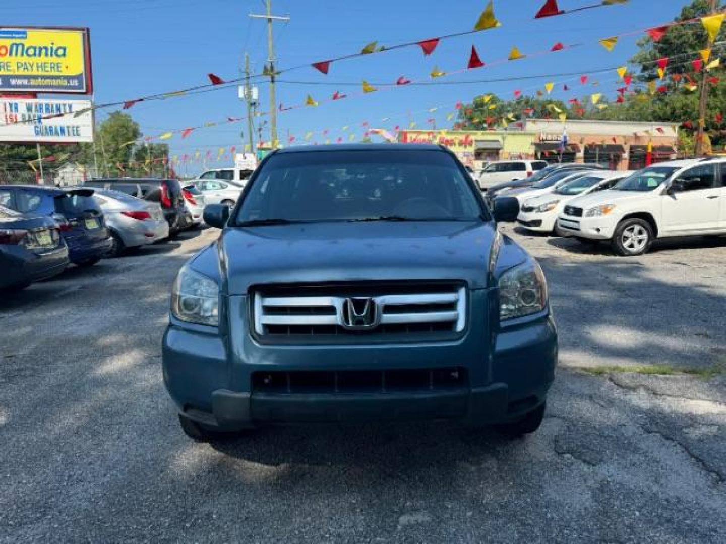 2006 Blue Honda Pilot LX (5FNYF28106B) with an 3.5L V6 SOHC 24V engine, 5-Speed Automatic transmission, located at 1806 Veterans Memorial Hwy SW, Austell, GA, 30168, (770) 944-9558, 33.817959, -84.606987 - Photo#1