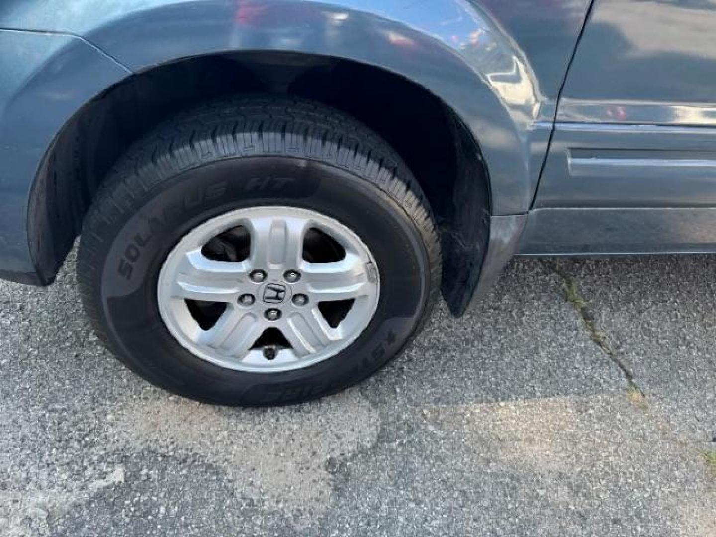 2006 Blue Honda Pilot LX (5FNYF28106B) with an 3.5L V6 SOHC 24V engine, 5-Speed Automatic transmission, located at 1806 Veterans Memorial Hwy SW, Austell, GA, 30168, (770) 944-9558, 33.817959, -84.606987 - Photo#20