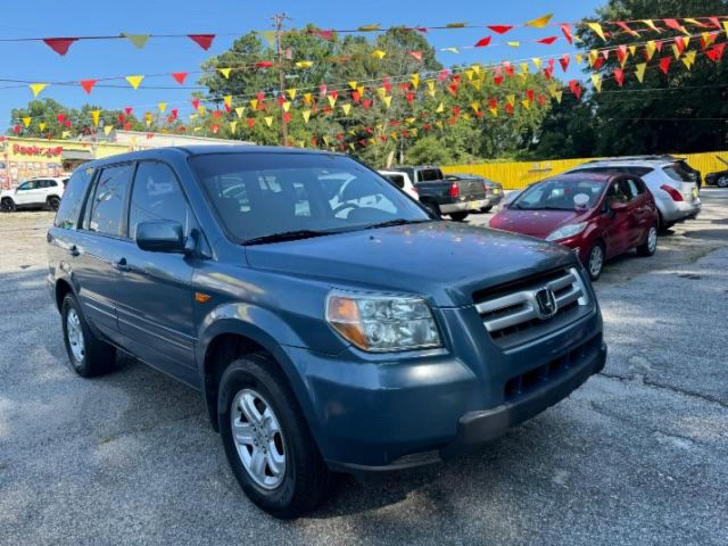 2006 Blue Honda Pilot LX (5FNYF28106B) with an 3.5L V6 SOHC 24V engine, 5-Speed Automatic transmission, located at 1806 Veterans Memorial Hwy SW, Austell, GA, 30168, (770) 944-9558, 33.817959, -84.606987 - Photo#2