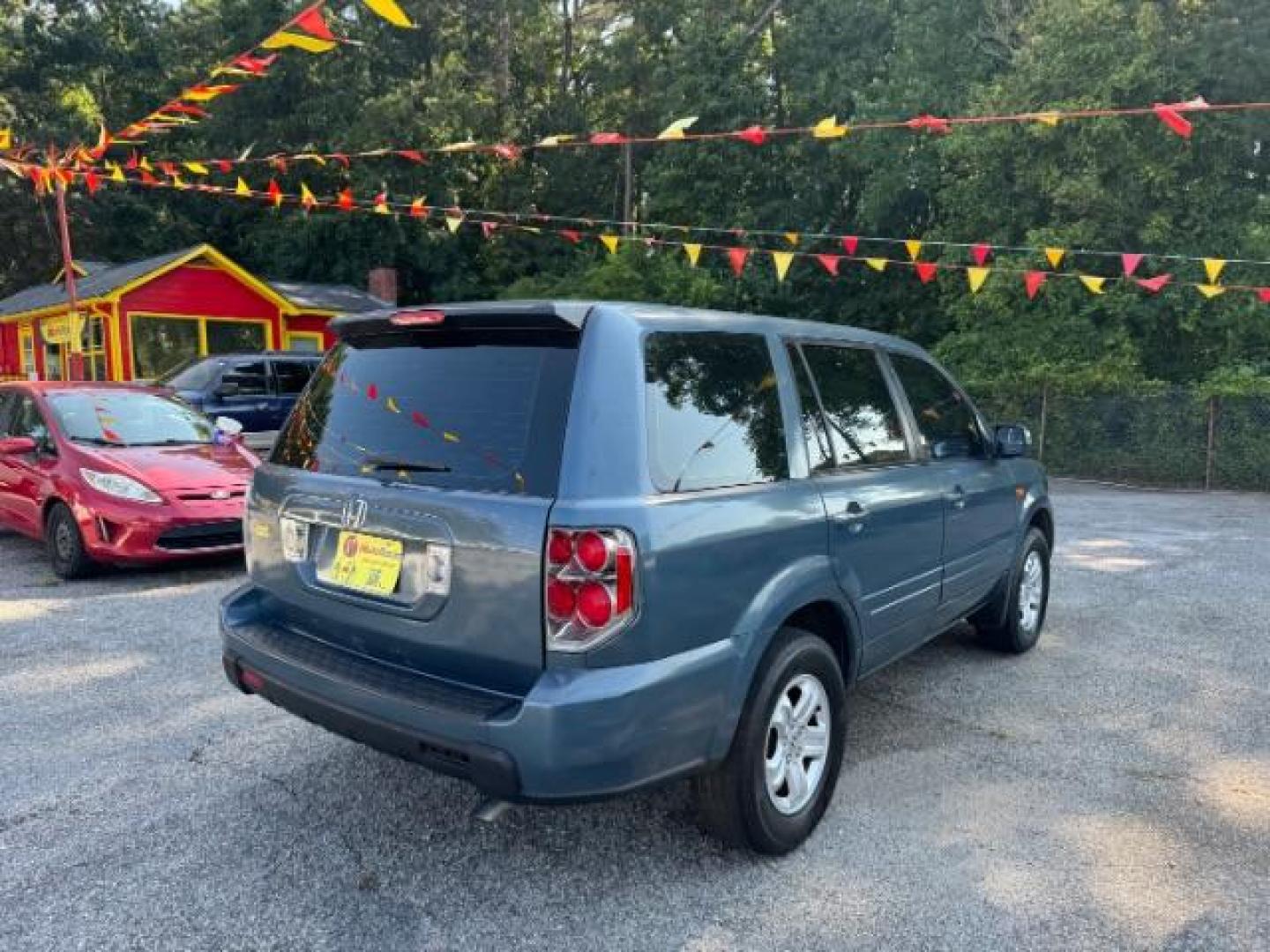 2006 Blue Honda Pilot LX (5FNYF28106B) with an 3.5L V6 SOHC 24V engine, 5-Speed Automatic transmission, located at 1806 Veterans Memorial Hwy SW, Austell, GA, 30168, (770) 944-9558, 33.817959, -84.606987 - Photo#3