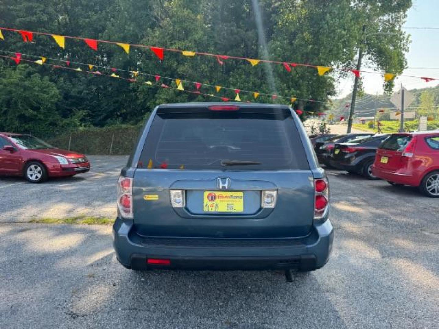 2006 Blue Honda Pilot LX (5FNYF28106B) with an 3.5L V6 SOHC 24V engine, 5-Speed Automatic transmission, located at 1806 Veterans Memorial Hwy SW, Austell, GA, 30168, (770) 944-9558, 33.817959, -84.606987 - Photo#4
