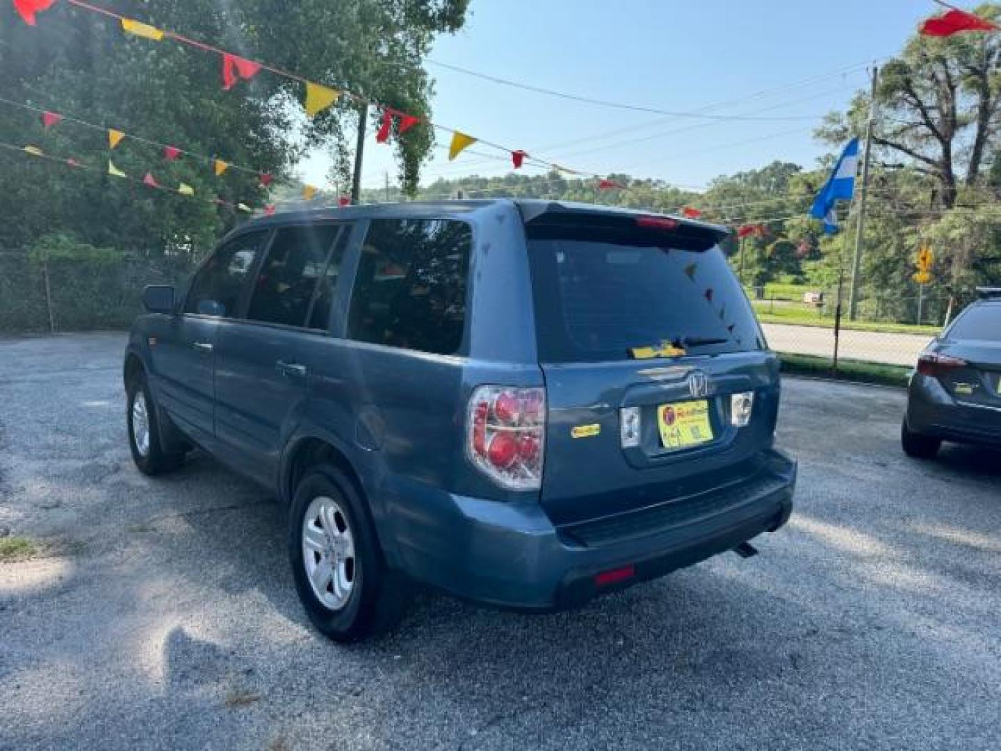 2006 Blue Honda Pilot LX (5FNYF28106B) with an 3.5L V6 SOHC 24V engine, 5-Speed Automatic transmission, located at 1806 Veterans Memorial Hwy SW, Austell, GA, 30168, (770) 944-9558, 33.817959, -84.606987 - Photo#5