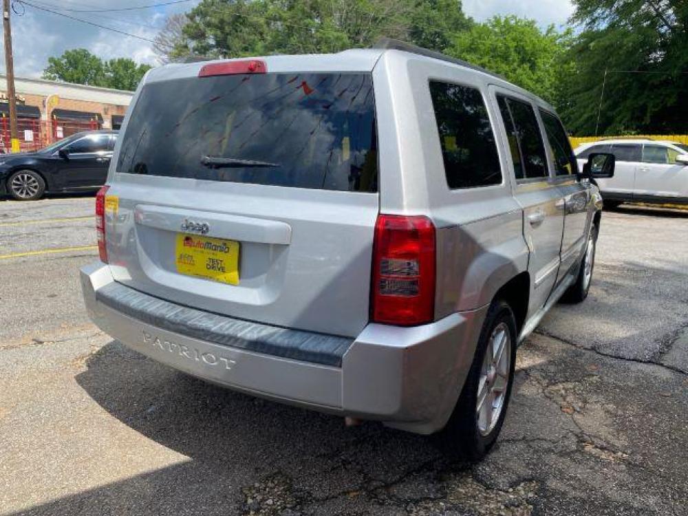 2010 SIlver Jeep Patriot Sport 2WD (1J4NT1GA8AD) with an 2.0L L4 DOHC 16V engine, located at 1806 Veterans Memorial Hwy SW, Austell, GA, 30168, (770) 944-9558, 33.817959, -84.606987 - Photo #3