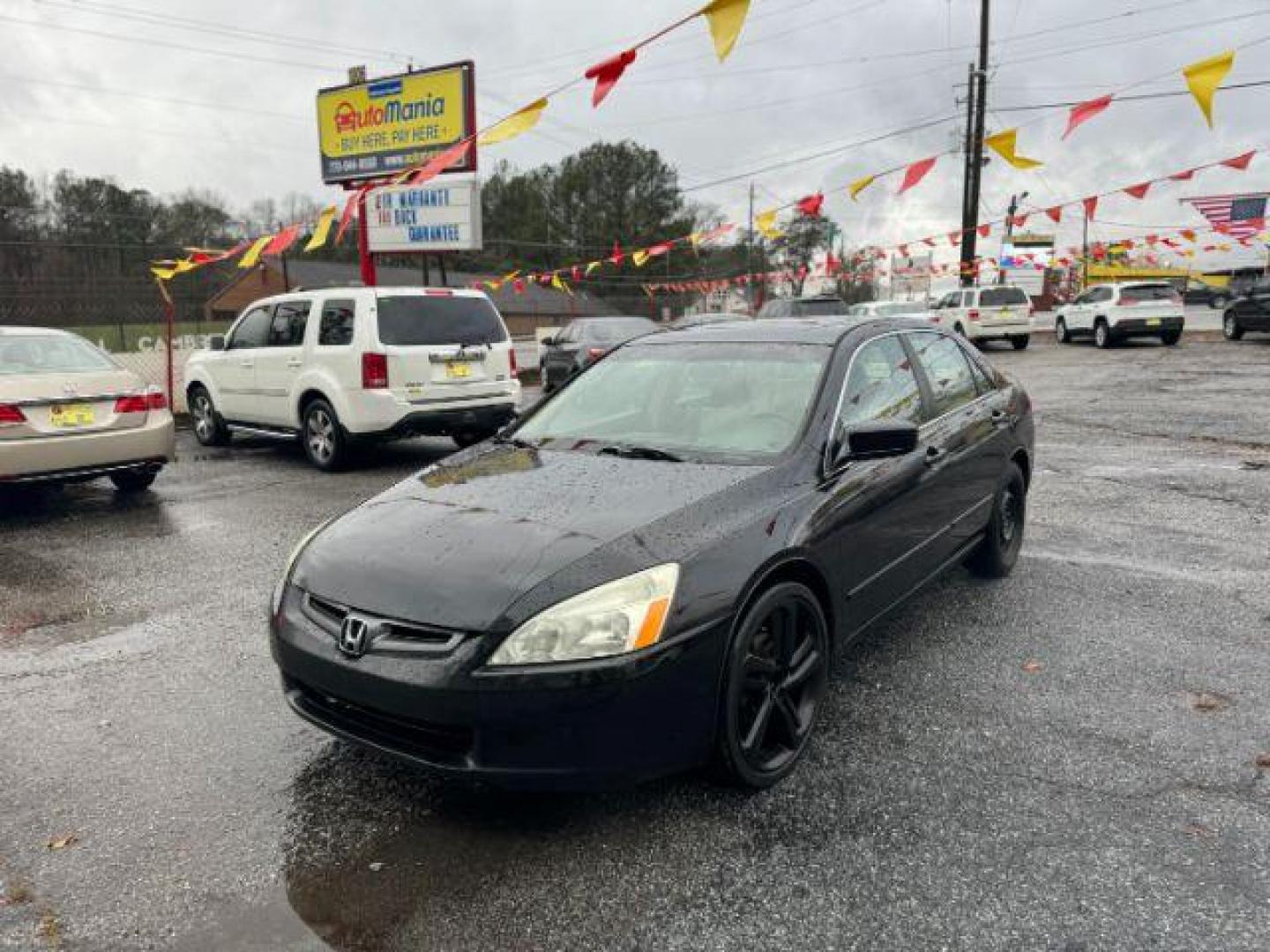 2005 Black Honda Accord EX-L Sedan AT with XM Radio (1HGCM56895A) with an 2.4L L4 DOHC 16V engine, 5-Speed Automatic transmission, located at 1806 Veterans Memorial Hwy SW, Austell, GA, 30168, (770) 944-9558, 33.817959, -84.606987 - Photo#0