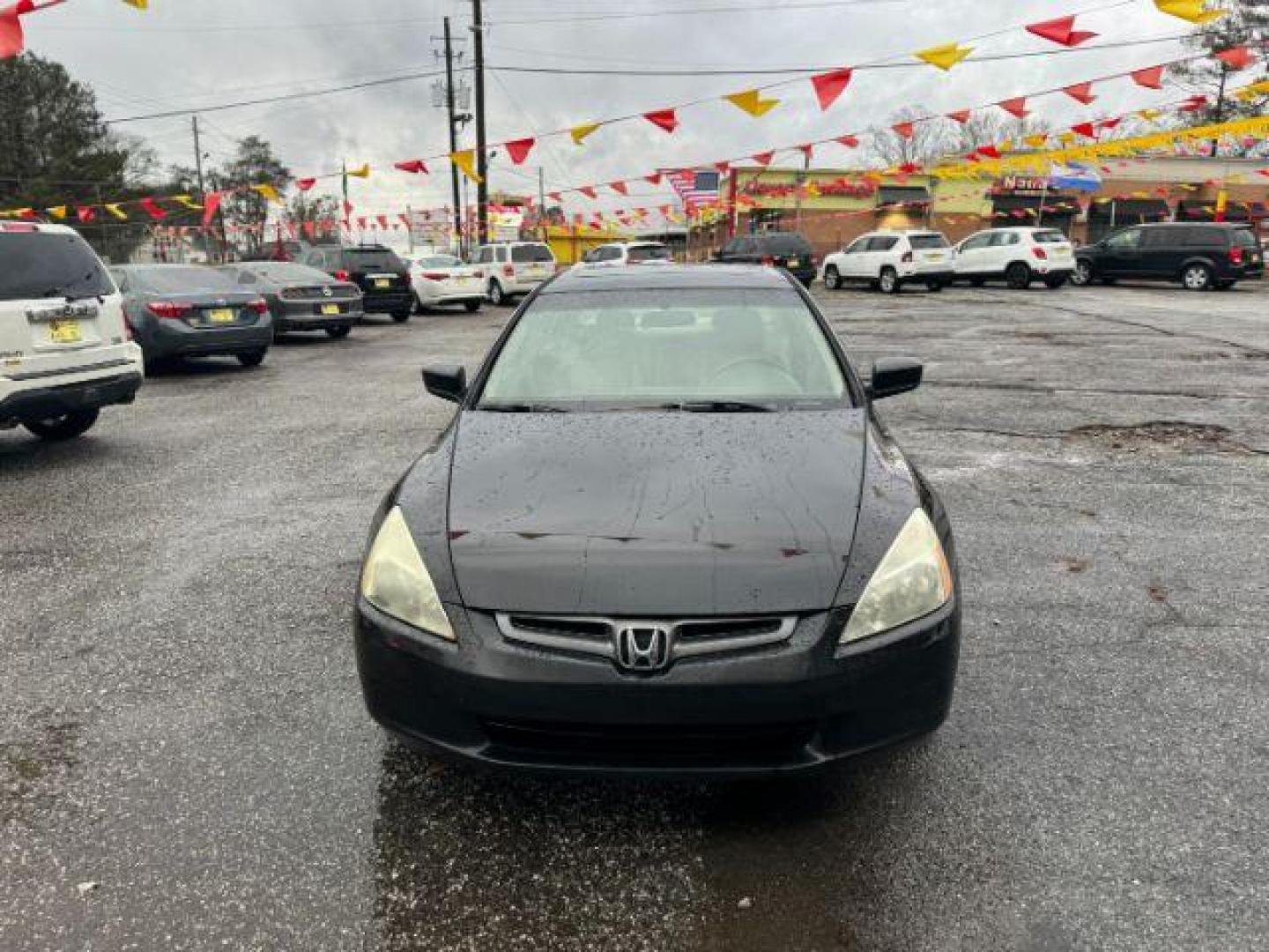 2005 Black Honda Accord EX-L Sedan AT with XM Radio (1HGCM56895A) with an 2.4L L4 DOHC 16V engine, 5-Speed Automatic transmission, located at 1806 Veterans Memorial Hwy SW, Austell, GA, 30168, (770) 944-9558, 33.817959, -84.606987 - Photo#1