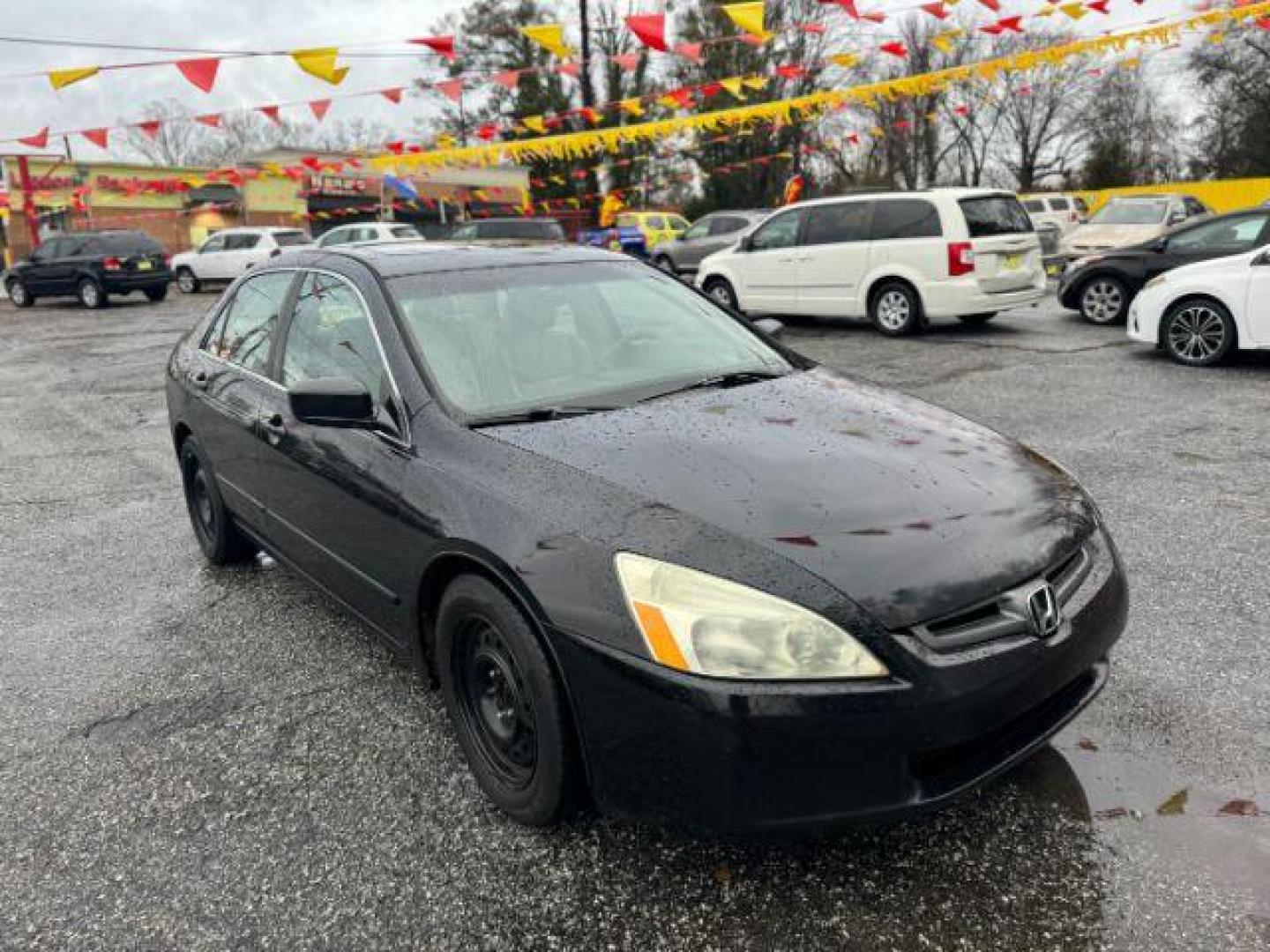 2005 Black Honda Accord EX-L Sedan AT with XM Radio (1HGCM56895A) with an 2.4L L4 DOHC 16V engine, 5-Speed Automatic transmission, located at 1806 Veterans Memorial Hwy SW, Austell, GA, 30168, (770) 944-9558, 33.817959, -84.606987 - Photo#2