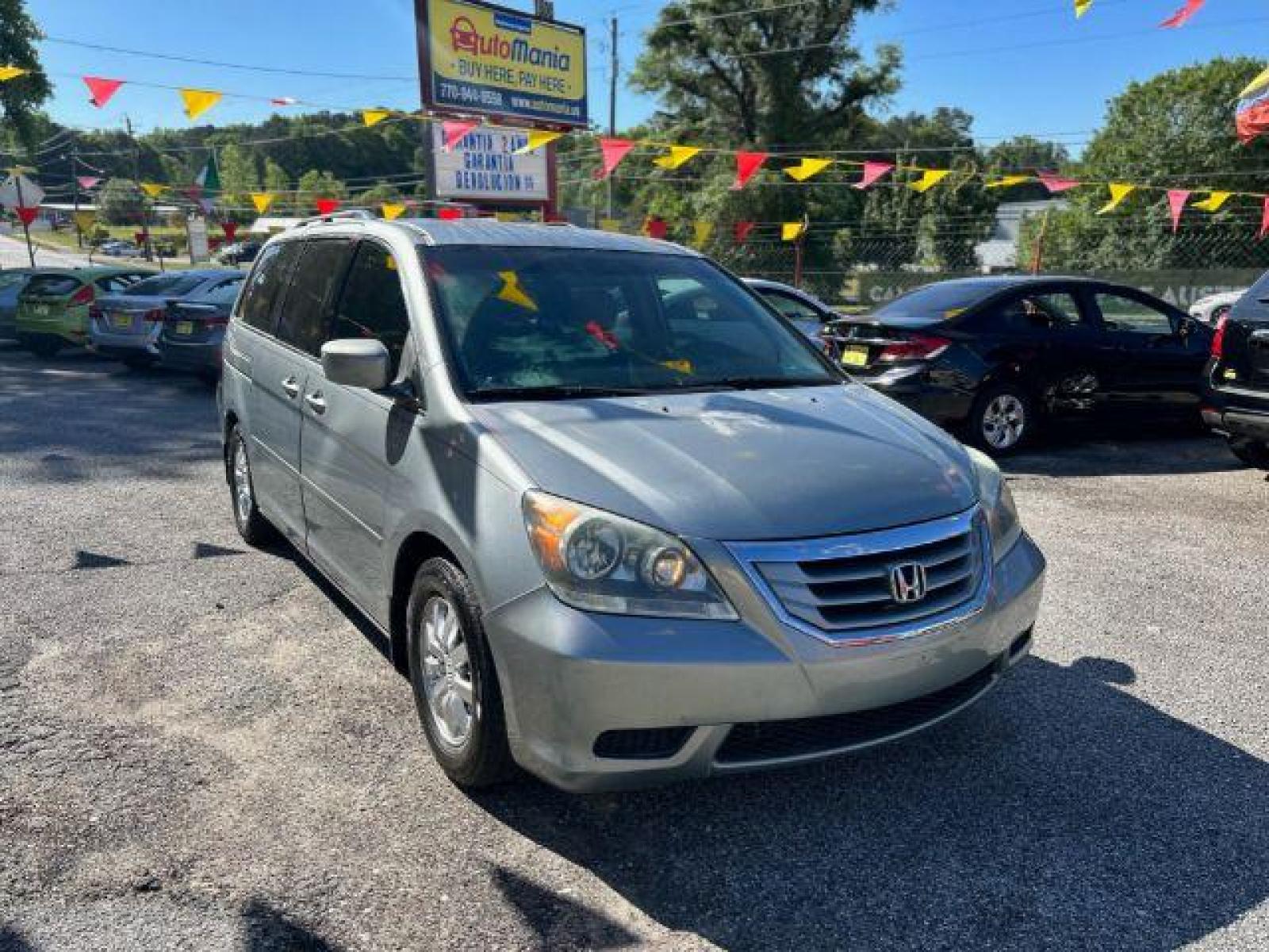 2010 Silver Honda Odyssey EX (5FNRL3H48AB) with an 3.5L V6 SOHC 24V engine, 5-Speed Automatic transmission, located at 1806 Veterans Memorial Hwy SW, Austell, GA, 30168, (770) 944-9558, 33.817959, -84.606987 - Photo #2