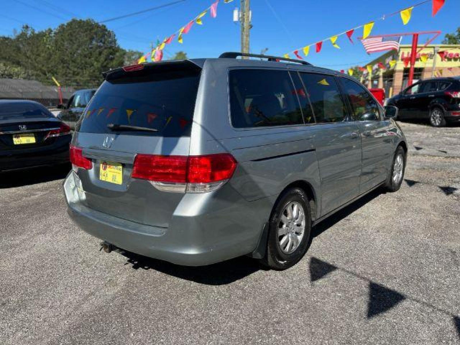 2010 Silver Honda Odyssey EX (5FNRL3H48AB) with an 3.5L V6 SOHC 24V engine, 5-Speed Automatic transmission, located at 1806 Veterans Memorial Hwy SW, Austell, GA, 30168, (770) 944-9558, 33.817959, -84.606987 - Photo #3