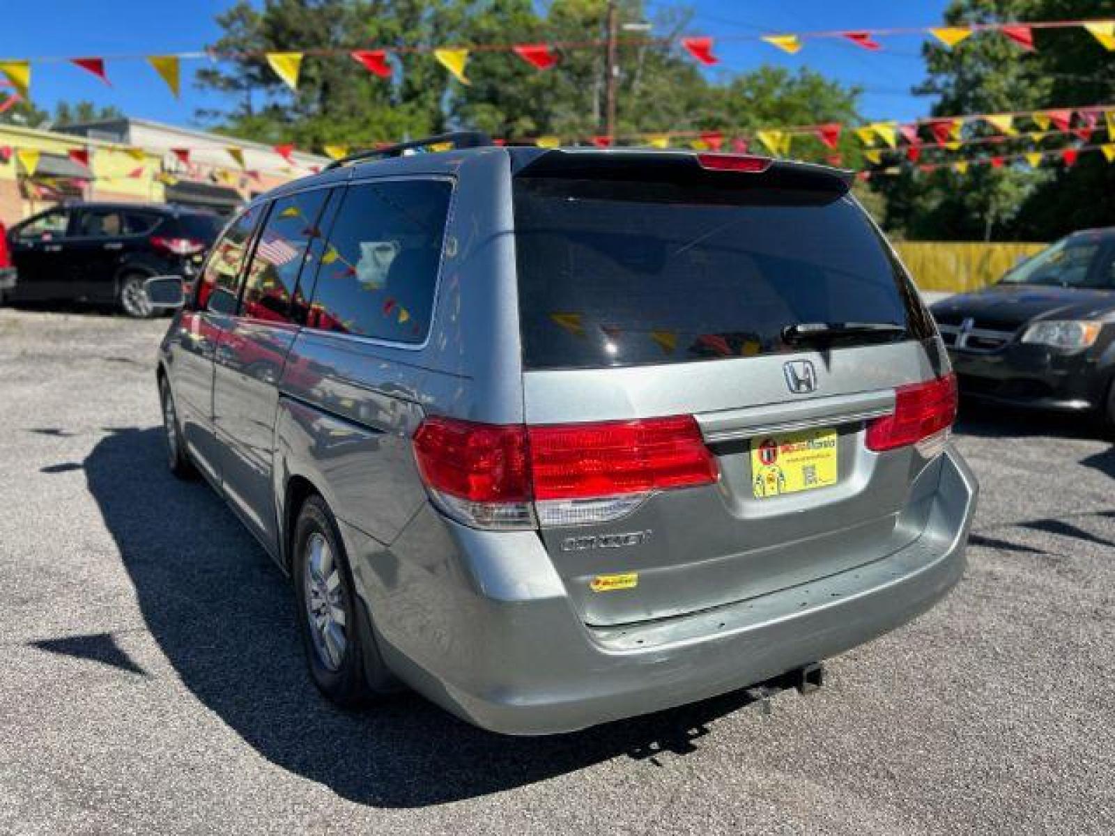 2010 Silver Honda Odyssey EX (5FNRL3H48AB) with an 3.5L V6 SOHC 24V engine, 5-Speed Automatic transmission, located at 1806 Veterans Memorial Hwy SW, Austell, GA, 30168, (770) 944-9558, 33.817959, -84.606987 - Photo #4