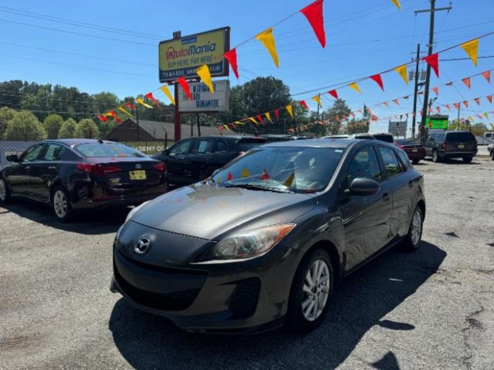 2012 GRAY Mazda MAZDA3 I Touring 5-Door (JM1BL1L83C1) with an 2.0L L4 DOHC 16V engine, 5-Speed Automatic transmission, located at 1806 Veterans Memorial Hwy SW, Austell, GA, 30168, (770) 944-9558, 33.817959, -84.606987 - Photo #0