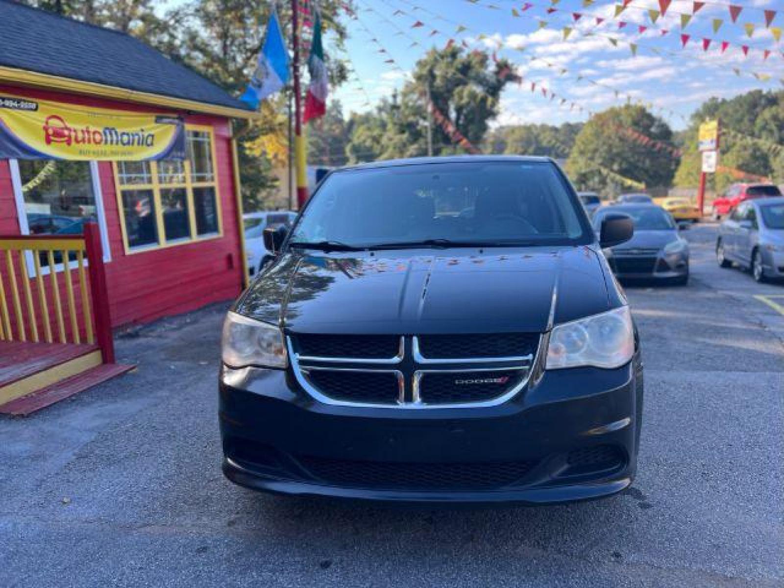 2013 Black Dodge Grand Caravan SE (2C4RDGBG3DR) with an 3.6L V6 DOHC 24V engine, 6-Speed Automatic transmission, located at 1806 Veterans Memorial Hwy SW, Austell, GA, 30168, (770) 944-9558, 33.817959, -84.606987 - Photo #1