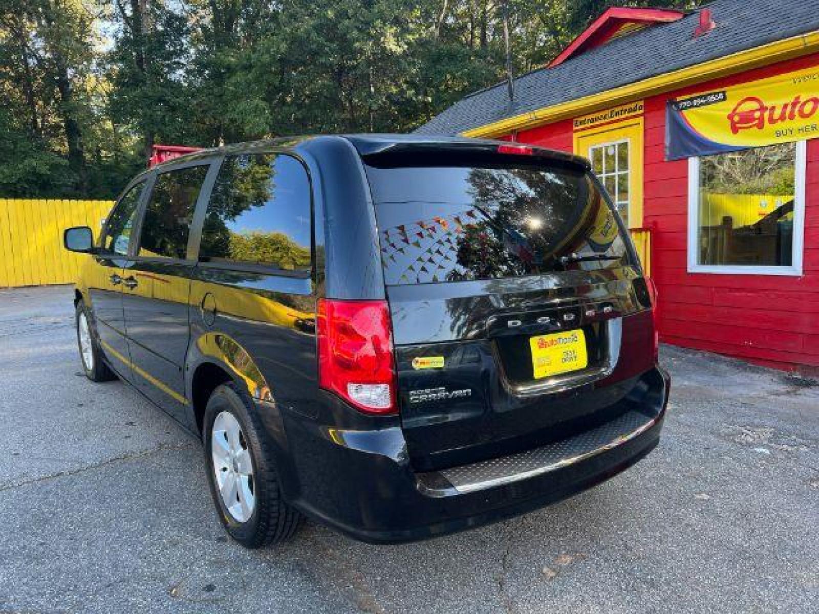 2013 Black Dodge Grand Caravan SE (2C4RDGBG3DR) with an 3.6L V6 DOHC 24V engine, 6-Speed Automatic transmission, located at 1806 Veterans Memorial Hwy SW, Austell, GA, 30168, (770) 944-9558, 33.817959, -84.606987 - Photo #5