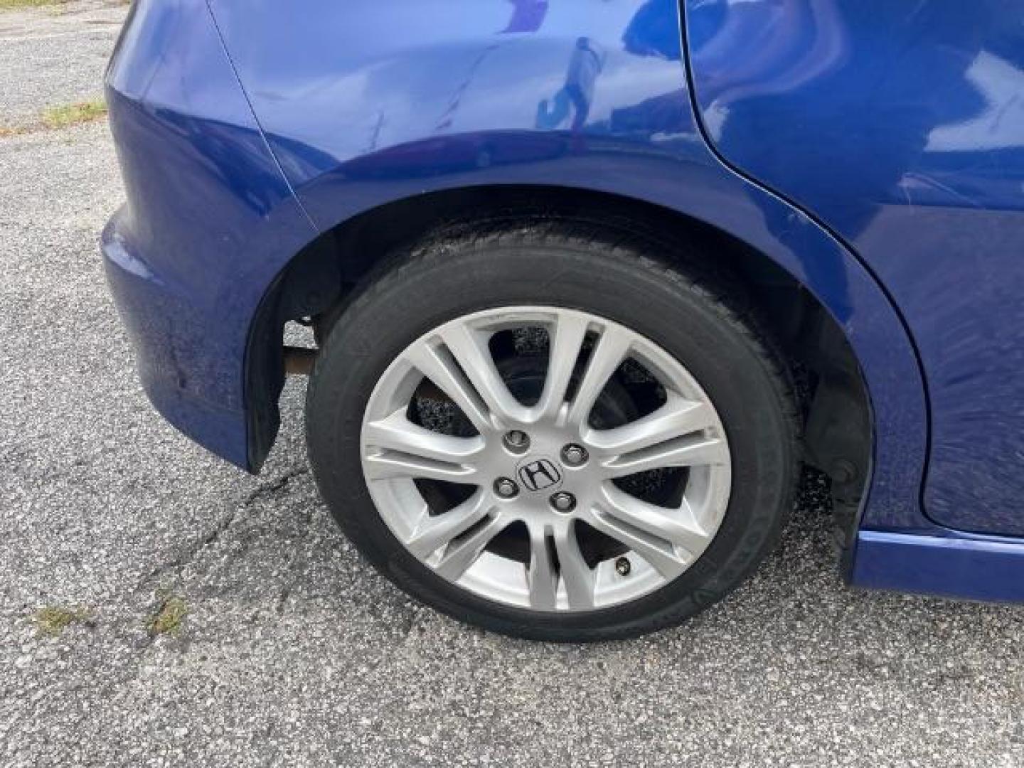 2011 Blue Honda Fit Sport 5-Speed AT (JHMGE8H5XBC) with an 1.5L L4 SOHC 16V engine, 5-Speed Automatic transmission, located at 1806 Veterans Memorial Hwy SW, Austell, GA, 30168, (770) 944-9558, 33.817959, -84.606987 - Photo#16