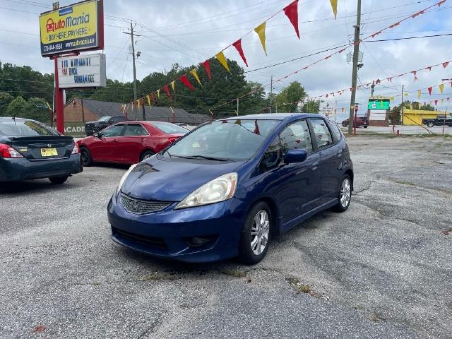2011 Blue Honda Fit Sport 5-Speed AT (JHMGE8H5XBC) with an 1.5L L4 SOHC 16V engine, 5-Speed Automatic transmission, located at 1806 Veterans Memorial Hwy SW, Austell, GA, 30168, (770) 944-9558, 33.817959, -84.606987 - Photo#2
