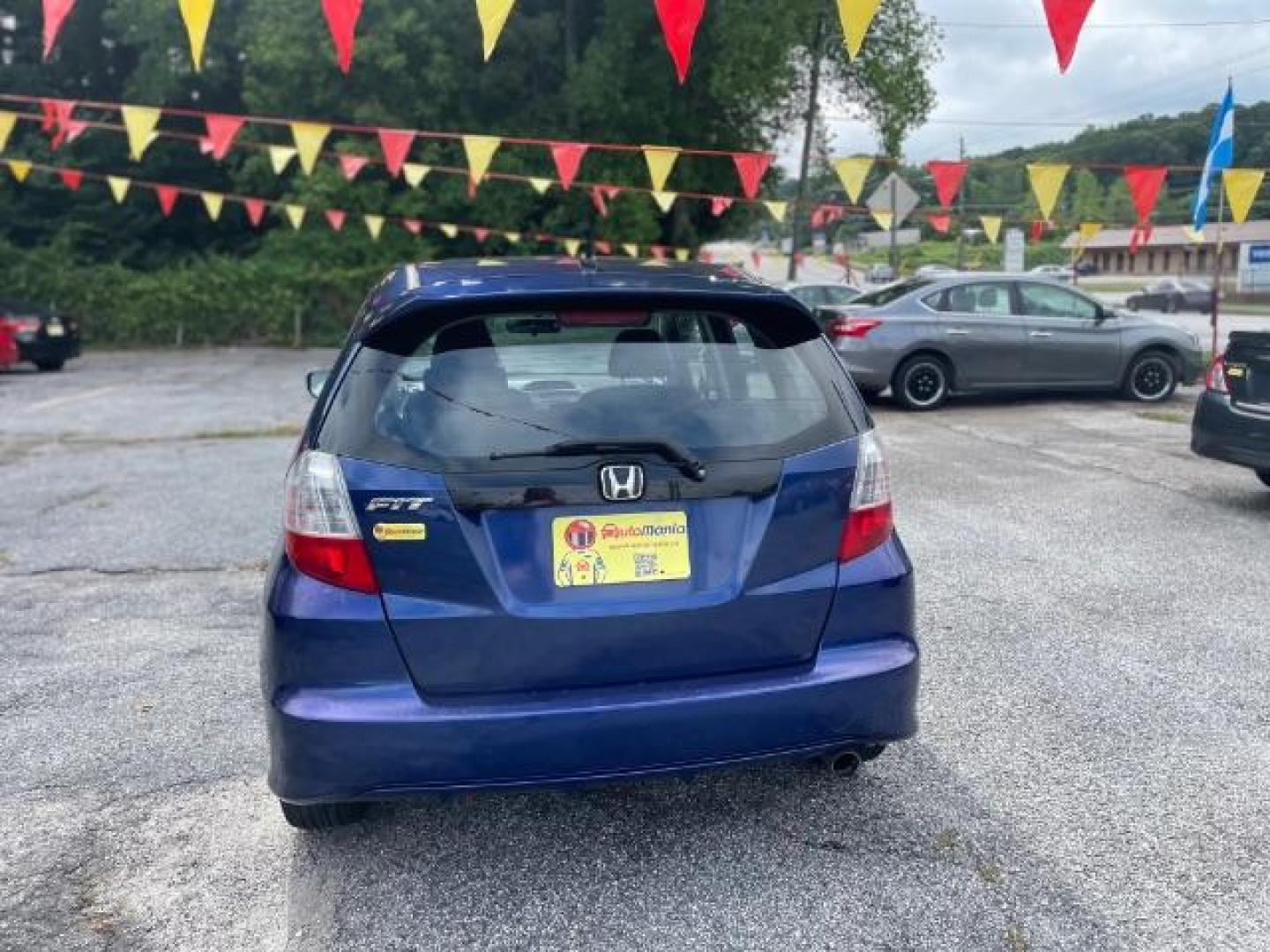 2011 Blue Honda Fit Sport 5-Speed AT (JHMGE8H5XBC) with an 1.5L L4 SOHC 16V engine, 5-Speed Automatic transmission, located at 1806 Veterans Memorial Hwy SW, Austell, GA, 30168, (770) 944-9558, 33.817959, -84.606987 - Photo#4