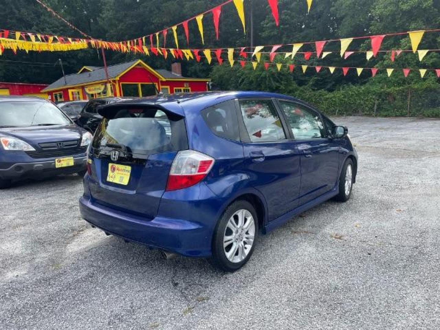 2011 Blue Honda Fit Sport 5-Speed AT (JHMGE8H5XBC) with an 1.5L L4 SOHC 16V engine, 5-Speed Automatic transmission, located at 1806 Veterans Memorial Hwy SW, Austell, GA, 30168, (770) 944-9558, 33.817959, -84.606987 - Photo#5