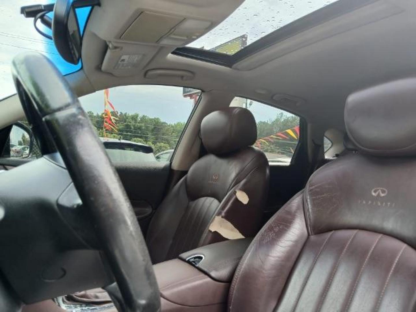 2010 Purple Infiniti EX EX35 Journey AWD (JN1AJ0HR2AM) with an 3.5L V6 DOHC 24V engine, 5-Speed Automatic Overdrive transmission, located at 1806 Veterans Memorial Hwy SW, Austell, GA, 30168, (770) 944-9558, 33.817959, -84.606987 - Photo#20