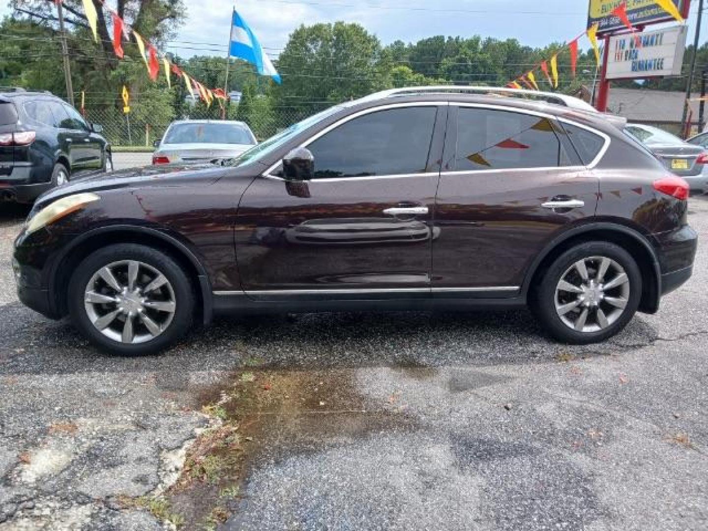 2010 Purple Infiniti EX EX35 Journey AWD (JN1AJ0HR2AM) with an 3.5L V6 DOHC 24V engine, 5-Speed Automatic Overdrive transmission, located at 1806 Veterans Memorial Hwy SW, Austell, GA, 30168, (770) 944-9558, 33.817959, -84.606987 - Photo#2