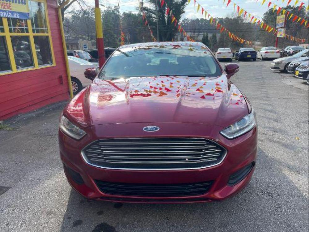 2016 Red Ford Fusion SE (3FA6P0H76GR) with an 2.5L L4 DOHC 16V engine, 6-Speed Automatic transmission, located at 1806 Veterans Memorial Hwy SW, Austell, GA, 30168, (770) 944-9558, 33.817959, -84.606987 - Photo #1