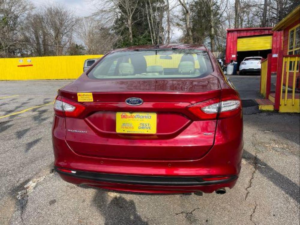 2016 Red Ford Fusion SE (3FA6P0H76GR) with an 2.5L L4 DOHC 16V engine, 6-Speed Automatic transmission, located at 1806 Veterans Memorial Hwy SW, Austell, GA, 30168, (770) 944-9558, 33.817959, -84.606987 - Photo #4