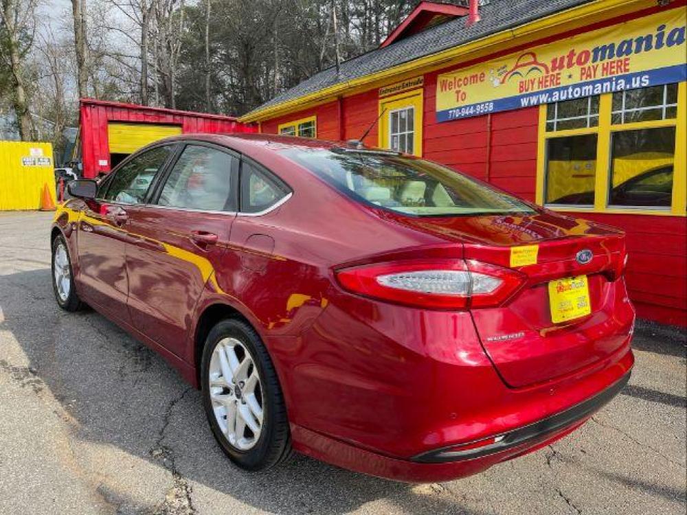 2016 Red Ford Fusion SE (3FA6P0H76GR) with an 2.5L L4 DOHC 16V engine, 6-Speed Automatic transmission, located at 1806 Veterans Memorial Hwy SW, Austell, GA, 30168, (770) 944-9558, 33.817959, -84.606987 - Photo #5