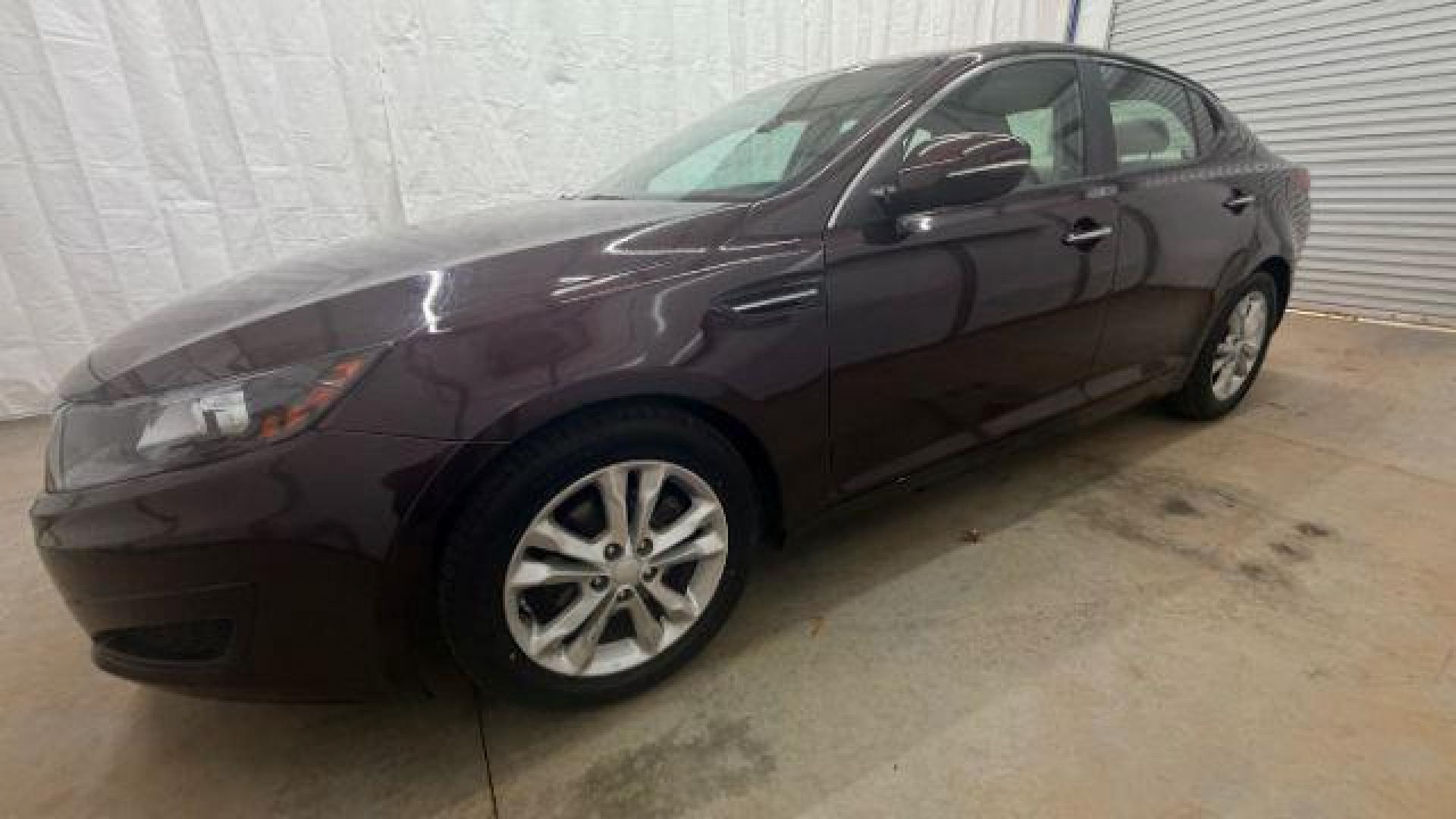 2012 Maroon Kia Optima LX AT (5XXGM4A74CG) with an 2.4L L4 DOHC 16V engine, 6-Speed Automatic transmission, located at 1806 Veterans Memorial Hwy SW, Austell, GA, 30168, (770) 944-9558, 33.817959, -84.606987 - Photo#1