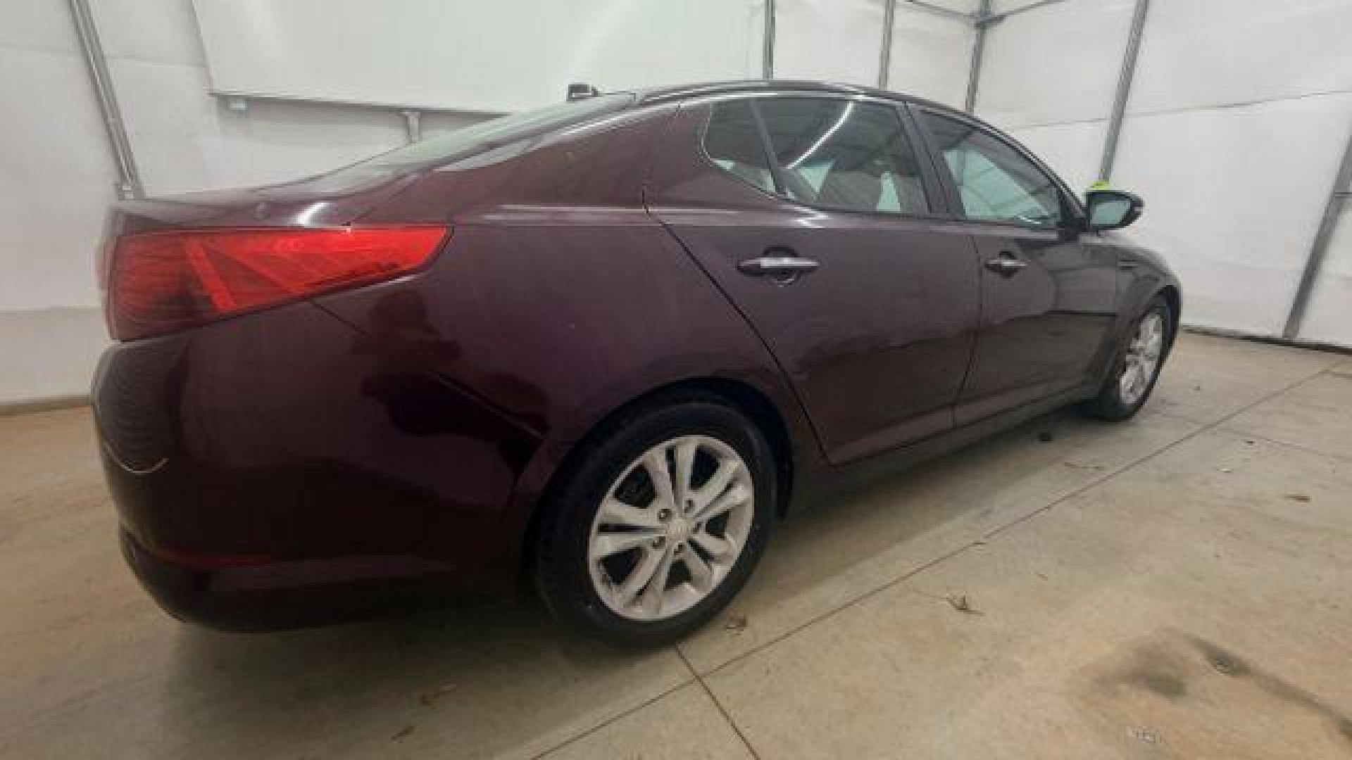 2012 Maroon Kia Optima LX AT (5XXGM4A74CG) with an 2.4L L4 DOHC 16V engine, 6-Speed Automatic transmission, located at 1806 Veterans Memorial Hwy SW, Austell, GA, 30168, (770) 944-9558, 33.817959, -84.606987 - Photo#6