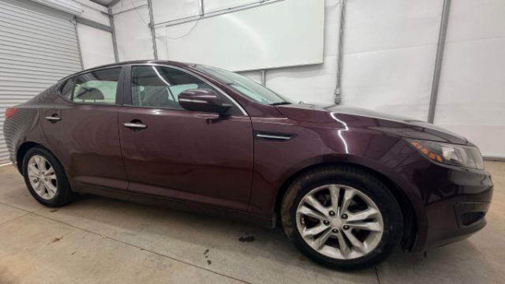 2012 Maroon Kia Optima LX AT (5XXGM4A74CG) with an 2.4L L4 DOHC 16V engine, 6-Speed Automatic transmission, located at 1806 Veterans Memorial Hwy SW, Austell, GA, 30168, (770) 944-9558, 33.817959, -84.606987 - Photo#7