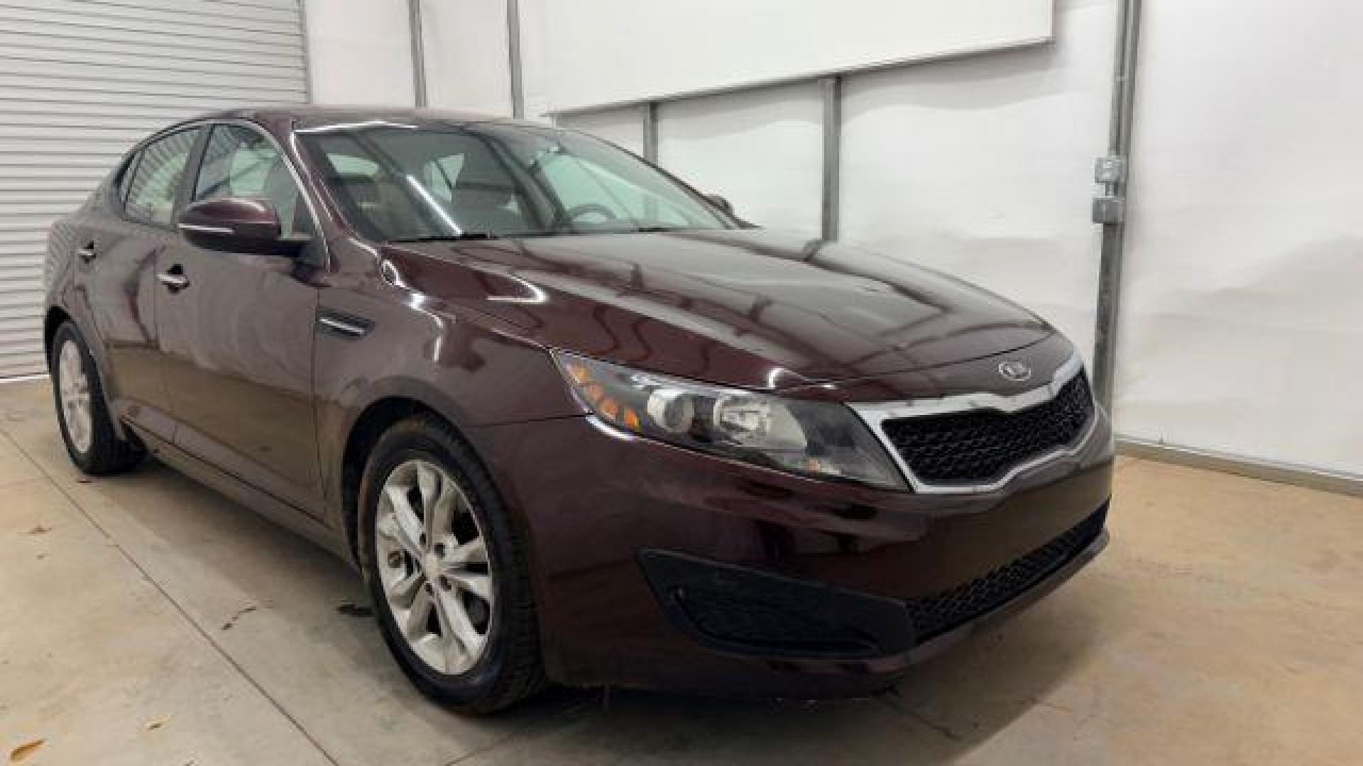 2012 Maroon Kia Optima LX AT (5XXGM4A74CG) with an 2.4L L4 DOHC 16V engine, 6-Speed Automatic transmission, located at 1806 Veterans Memorial Hwy SW, Austell, GA, 30168, (770) 944-9558, 33.817959, -84.606987 - Photo#8