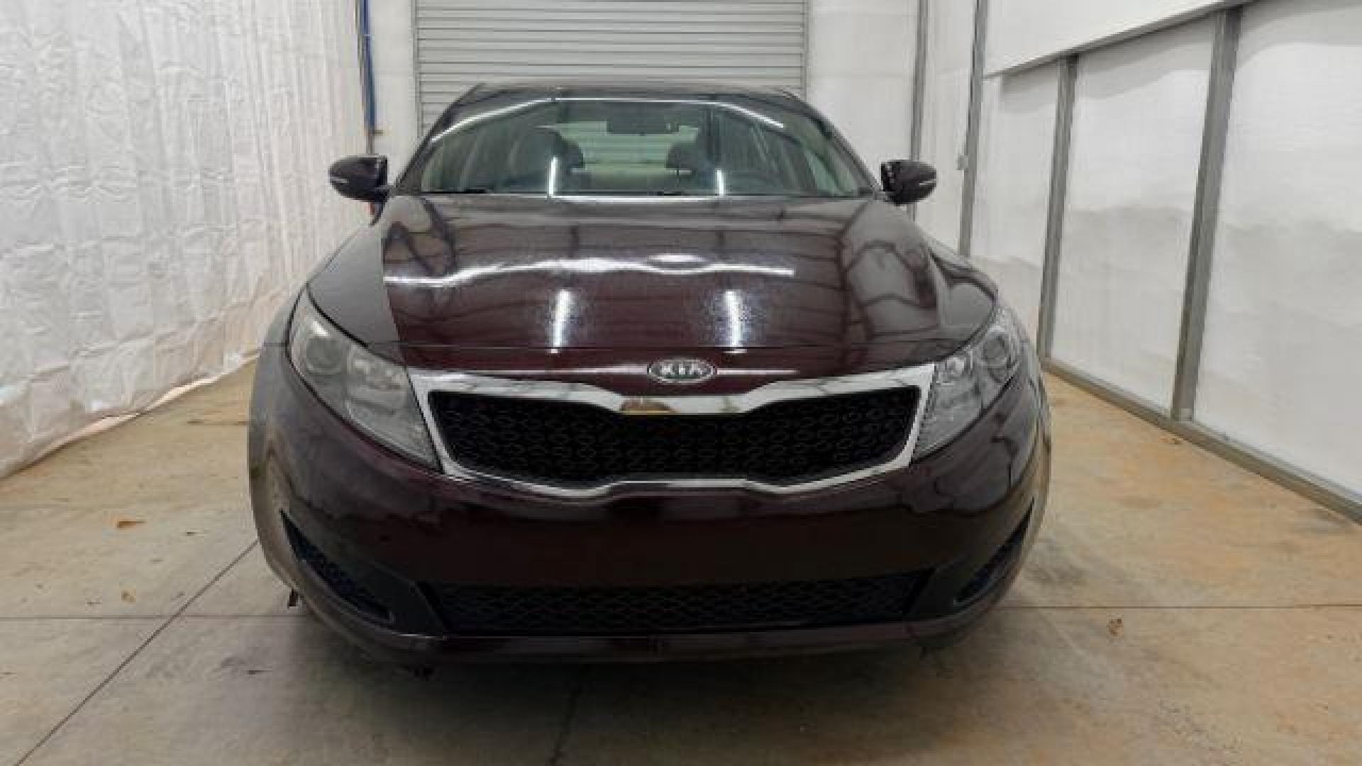 2012 Maroon Kia Optima LX AT (5XXGM4A74CG) with an 2.4L L4 DOHC 16V engine, 6-Speed Automatic transmission, located at 1806 Veterans Memorial Hwy SW, Austell, GA, 30168, (770) 944-9558, 33.817959, -84.606987 - Photo#9