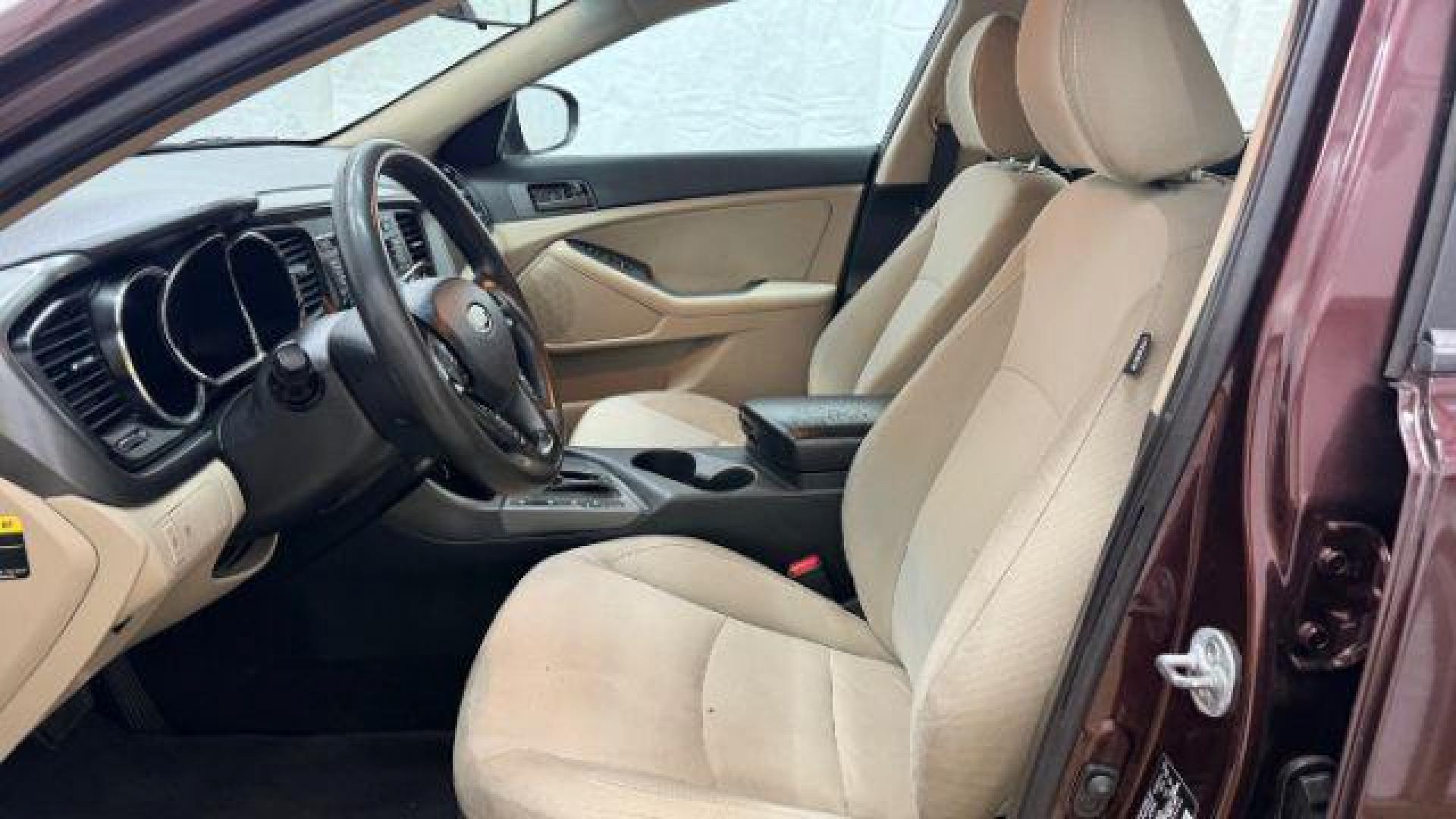 2012 Maroon Kia Optima LX AT (5XXGM4A74CG) with an 2.4L L4 DOHC 16V engine, 6-Speed Automatic transmission, located at 1806 Veterans Memorial Hwy SW, Austell, GA, 30168, (770) 944-9558, 33.817959, -84.606987 - Photo#11