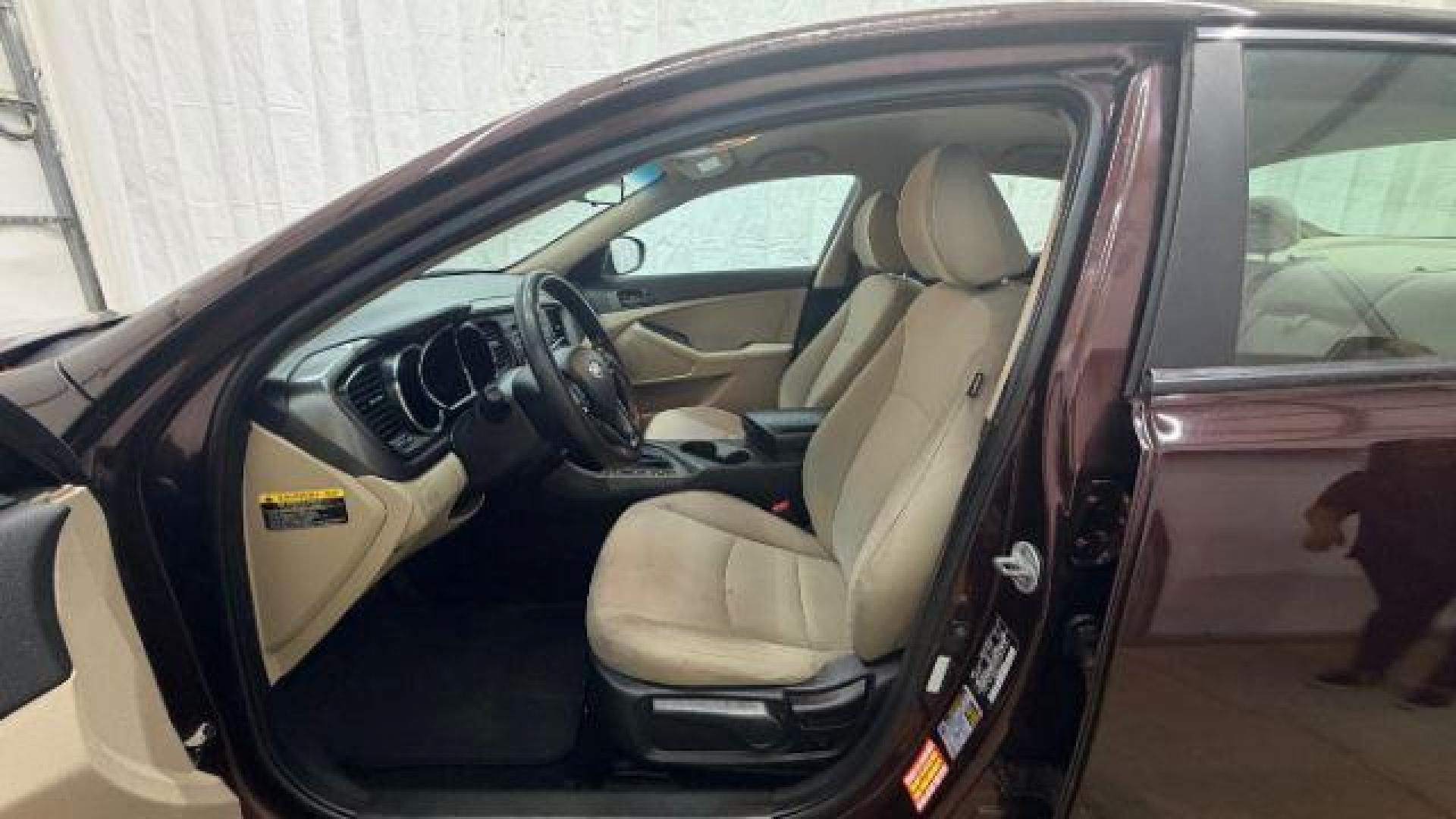 2012 Maroon Kia Optima LX AT (5XXGM4A74CG) with an 2.4L L4 DOHC 16V engine, 6-Speed Automatic transmission, located at 1806 Veterans Memorial Hwy SW, Austell, GA, 30168, (770) 944-9558, 33.817959, -84.606987 - Photo#12