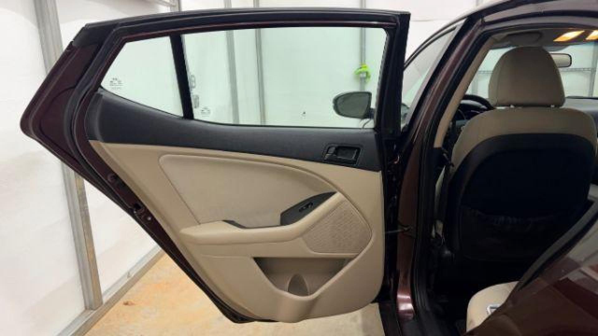 2012 Maroon Kia Optima LX AT (5XXGM4A74CG) with an 2.4L L4 DOHC 16V engine, 6-Speed Automatic transmission, located at 1806 Veterans Memorial Hwy SW, Austell, GA, 30168, (770) 944-9558, 33.817959, -84.606987 - Photo#13