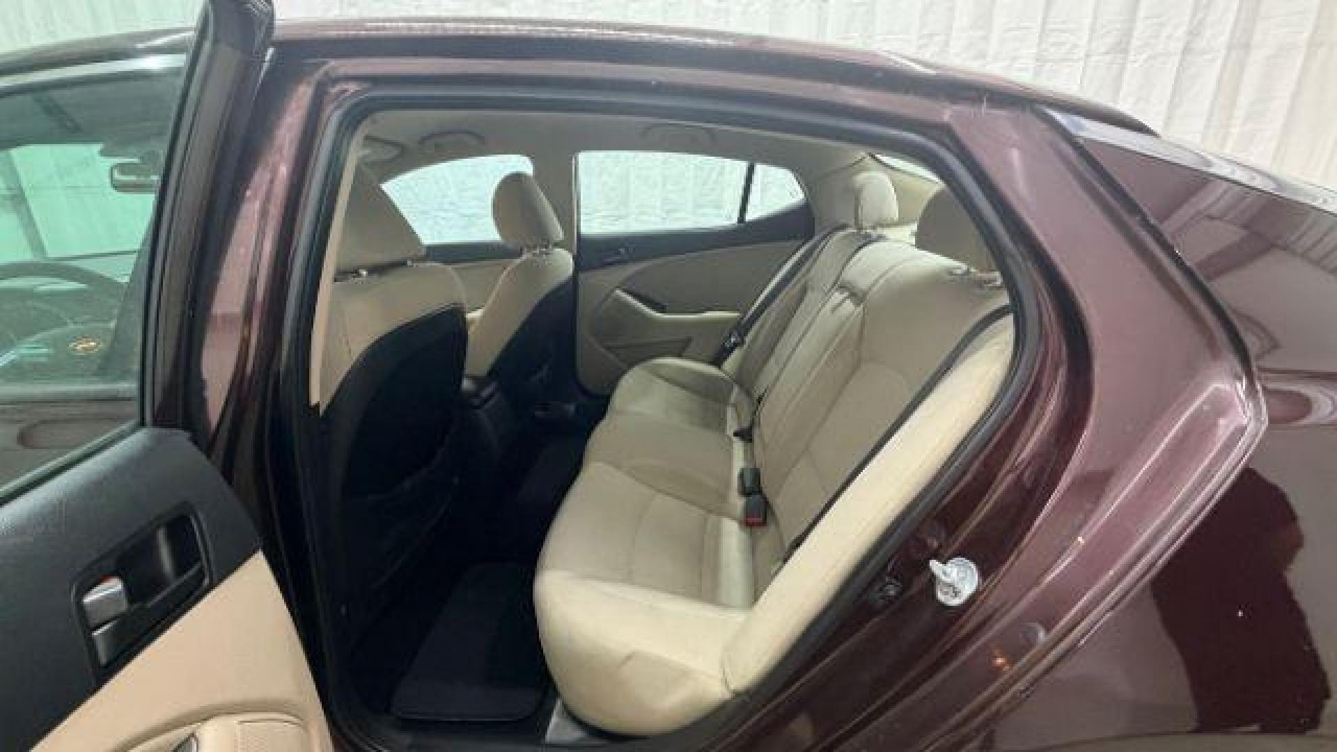 2012 Maroon Kia Optima LX AT (5XXGM4A74CG) with an 2.4L L4 DOHC 16V engine, 6-Speed Automatic transmission, located at 1806 Veterans Memorial Hwy SW, Austell, GA, 30168, (770) 944-9558, 33.817959, -84.606987 - Photo#14