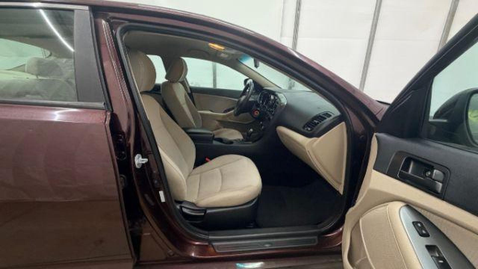 2012 Maroon Kia Optima LX AT (5XXGM4A74CG) with an 2.4L L4 DOHC 16V engine, 6-Speed Automatic transmission, located at 1806 Veterans Memorial Hwy SW, Austell, GA, 30168, (770) 944-9558, 33.817959, -84.606987 - Photo#17