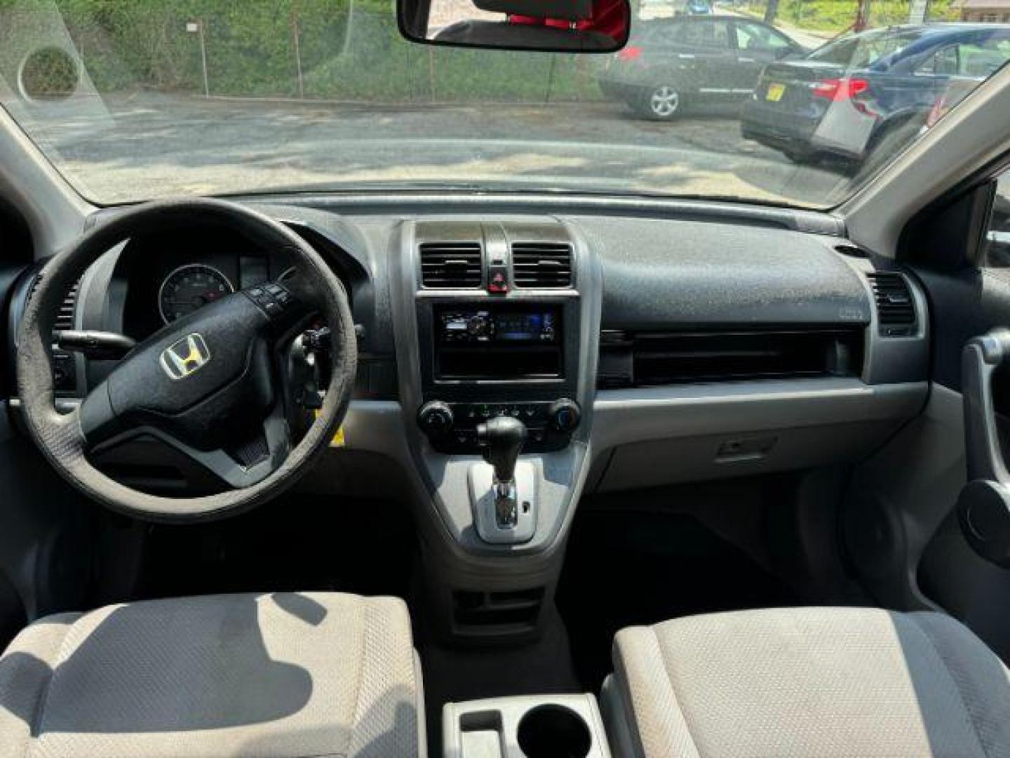 2009 Blue Honda CR-V LX 2WD 5-Speed AT (JHLRE38399C) with an 2.4L L4 DOHC 16V engine, 5-Speed Automatic transmission, located at 1806 Veterans Memorial Hwy SW, Austell, GA, 30168, (770) 944-9558, 33.817959, -84.606987 - Photo#9