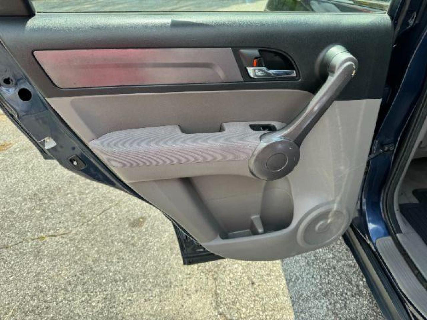 2009 Blue Honda CR-V LX 2WD 5-Speed AT (JHLRE38399C) with an 2.4L L4 DOHC 16V engine, 5-Speed Automatic transmission, located at 1806 Veterans Memorial Hwy SW, Austell, GA, 30168, (770) 944-9558, 33.817959, -84.606987 - Photo#10