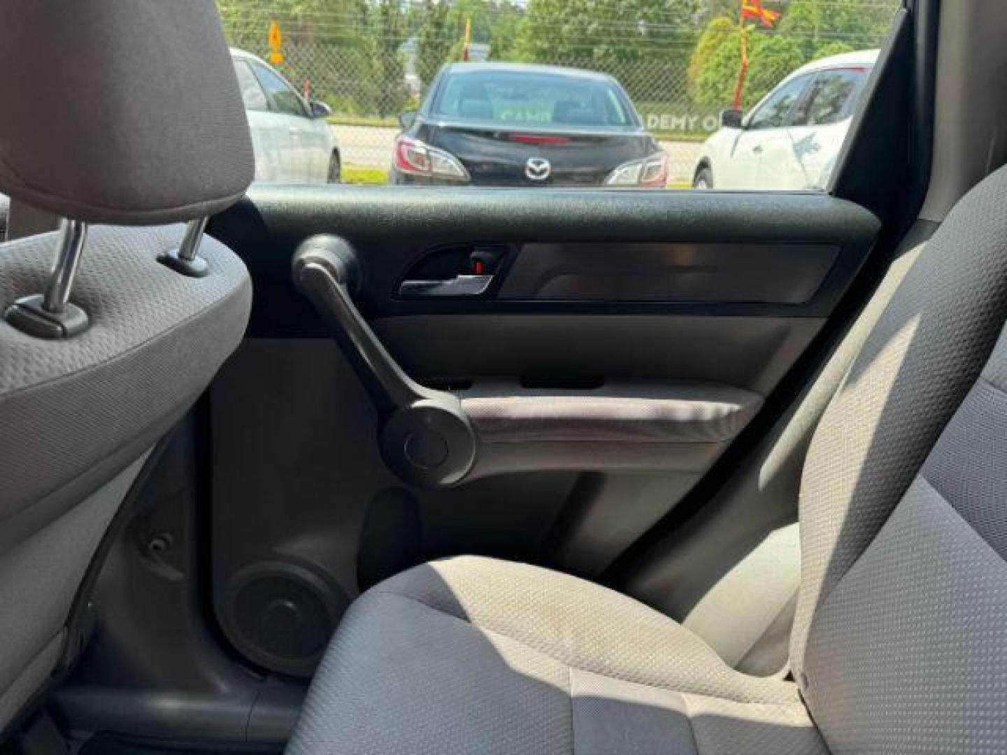2009 Blue Honda CR-V LX 2WD 5-Speed AT (JHLRE38399C) with an 2.4L L4 DOHC 16V engine, 5-Speed Automatic transmission, located at 1806 Veterans Memorial Hwy SW, Austell, GA, 30168, (770) 944-9558, 33.817959, -84.606987 - Photo#13