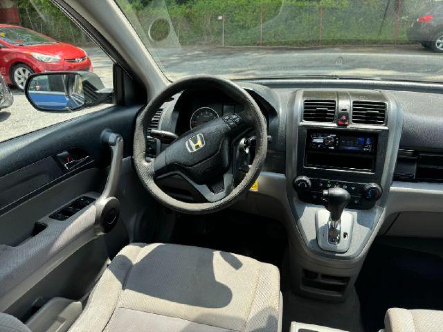 2009 Blue Honda CR-V LX 2WD 5-Speed AT (JHLRE38399C) with an 2.4L L4 DOHC 16V engine, 5-Speed Automatic transmission, located at 1806 Veterans Memorial Hwy SW, Austell, GA, 30168, (770) 944-9558, 33.817959, -84.606987 - Photo#12