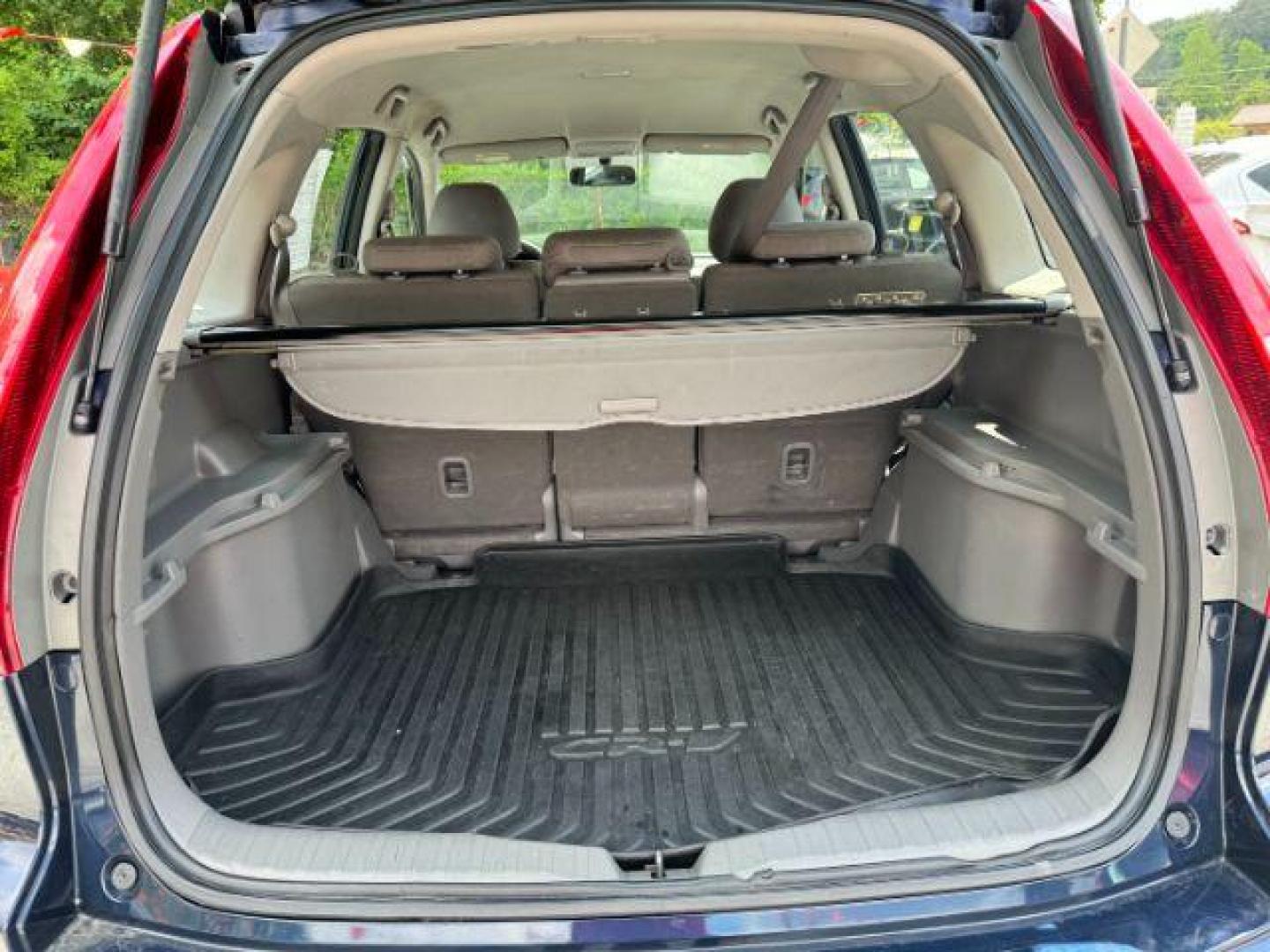 2009 Blue Honda CR-V LX 2WD 5-Speed AT (JHLRE38399C) with an 2.4L L4 DOHC 16V engine, 5-Speed Automatic transmission, located at 1806 Veterans Memorial Hwy SW, Austell, GA, 30168, (770) 944-9558, 33.817959, -84.606987 - Photo#16