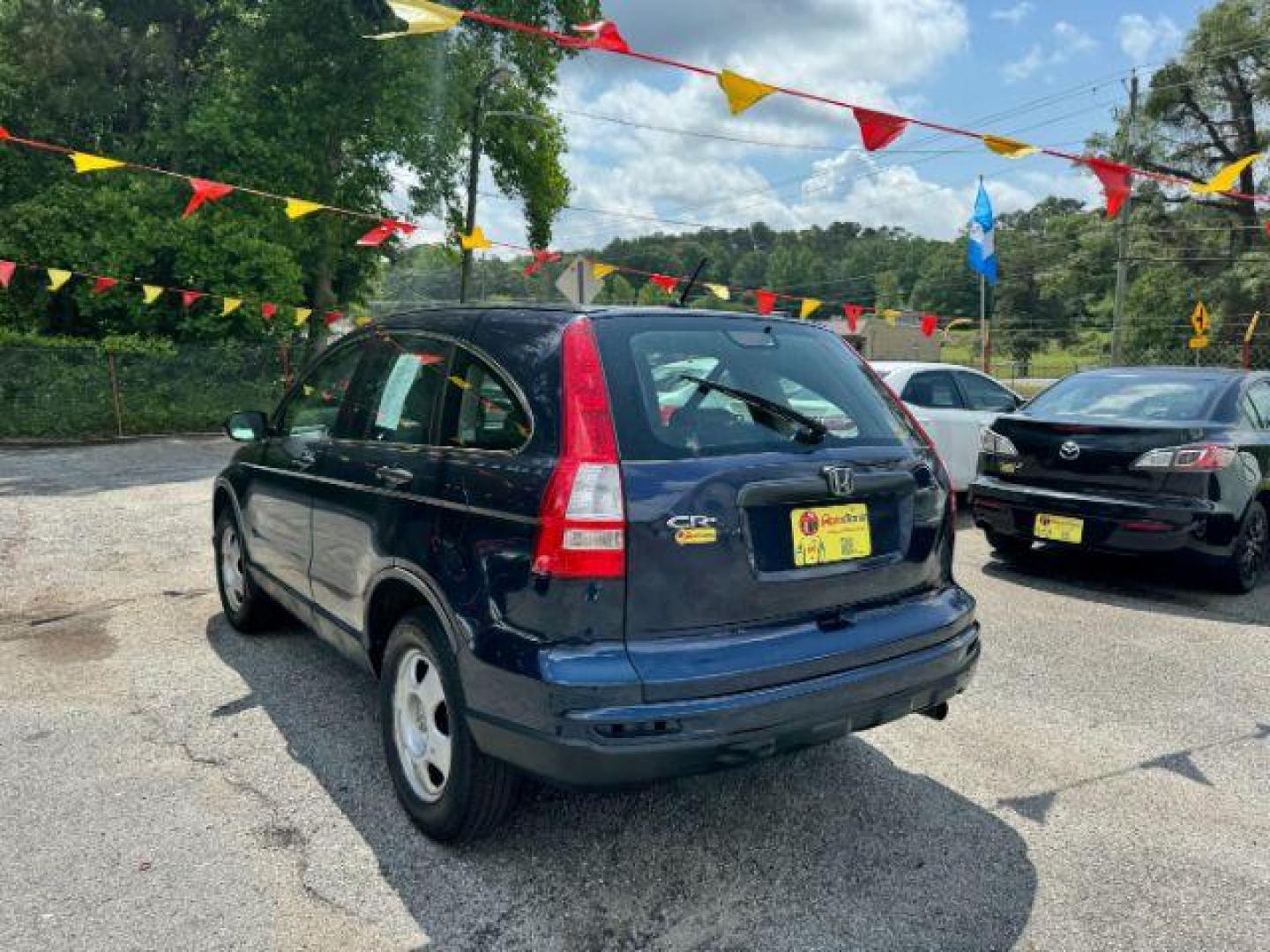 2009 Blue Honda CR-V LX 2WD 5-Speed AT (JHLRE38399C) with an 2.4L L4 DOHC 16V engine, 5-Speed Automatic transmission, located at 1806 Veterans Memorial Hwy SW, Austell, GA, 30168, (770) 944-9558, 33.817959, -84.606987 - Photo#3