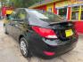2017 Black Hyundai Accent SE 4-Door 6A (KMHCT4AE0HU) with an 1.6L L4 DOHC 16V engine, 6-Speed Automatic transmission, located at 1806 Veterans Memorial Hwy SW, Austell, GA, 30168, (770) 944-9558, 33.817959, -84.606987 - Photo #5