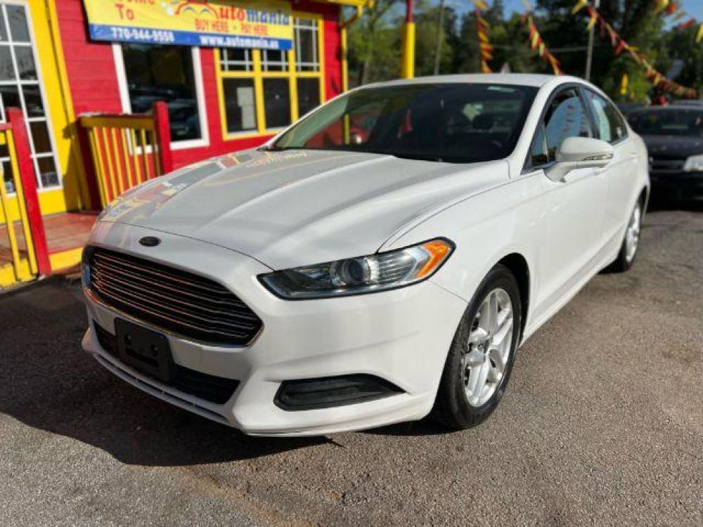2016 White Ford Fusion SE (3FA6P0H72GR) with an 2.5L L4 DOHC 16V engine, 6-Speed Automatic transmission, located at 1806 Veterans Memorial Hwy SW, Austell, GA, 30168, (770) 944-9558, 33.817959, -84.606987 - Photo #0