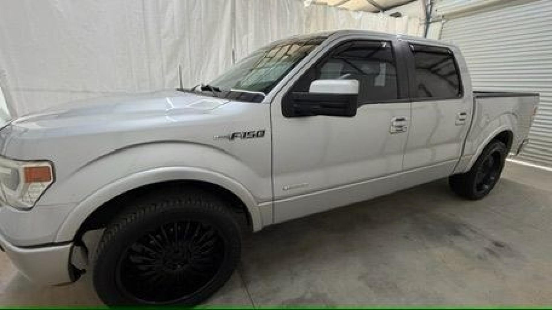 2014 Silver Ford F-150 LARIAT (1FTFW1CT0EK) with an 3.5L V6 TURBO engine, 6-Speed Automatic transmission, located at 1806 Veterans Memorial Hwy SW, Austell, GA, 30168, (770) 944-9558, 33.817959, -84.606987- Photo#1