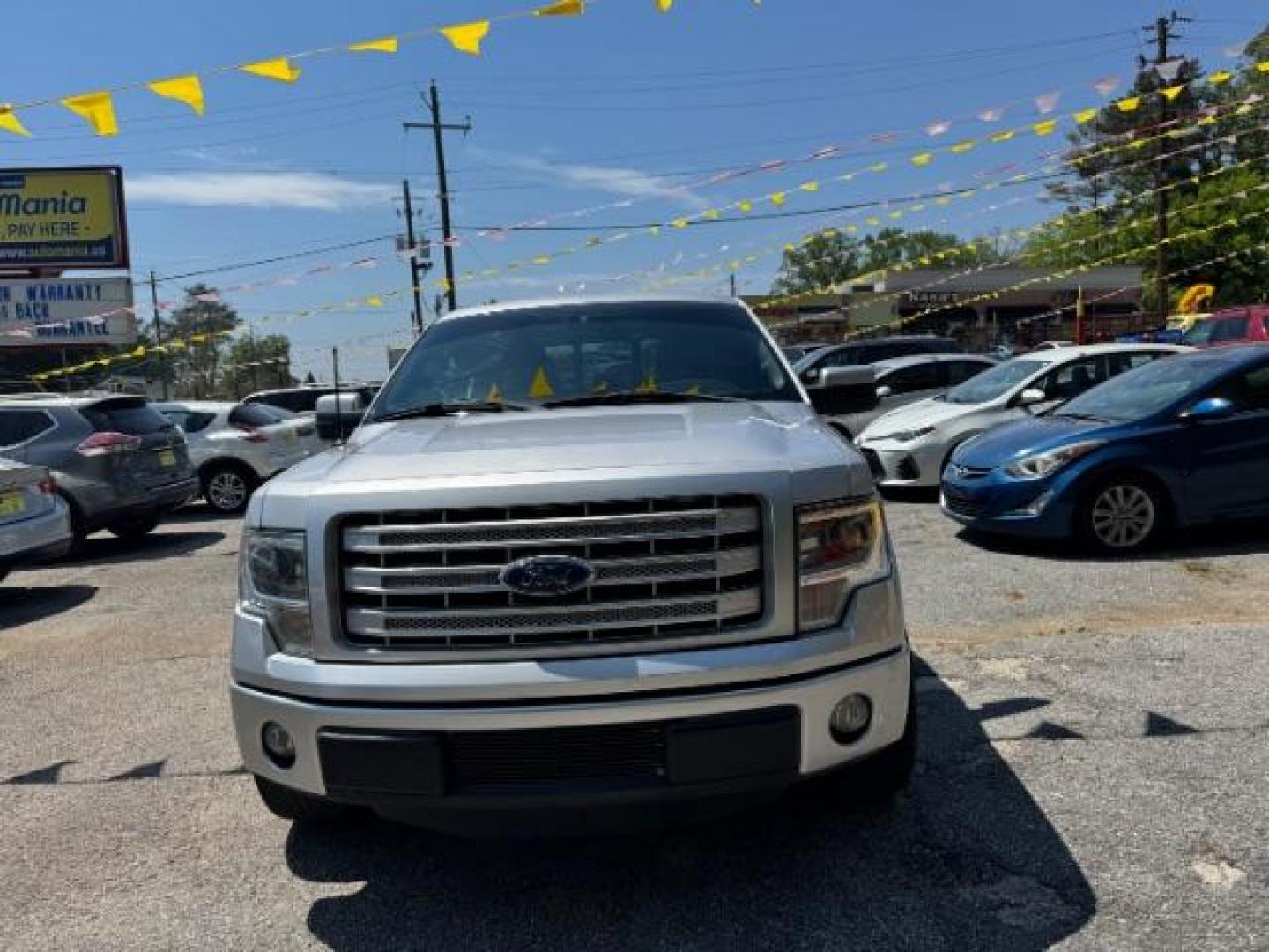 2014 Silver Ford F-150 LARIAT (1FTFW1CT0EK) with an 3.5L V6 TURBO engine, 6-Speed Automatic transmission, located at 1806 Veterans Memorial Hwy SW, Austell, GA, 30168, (770) 944-9558, 33.817959, -84.606987 - Photo#1